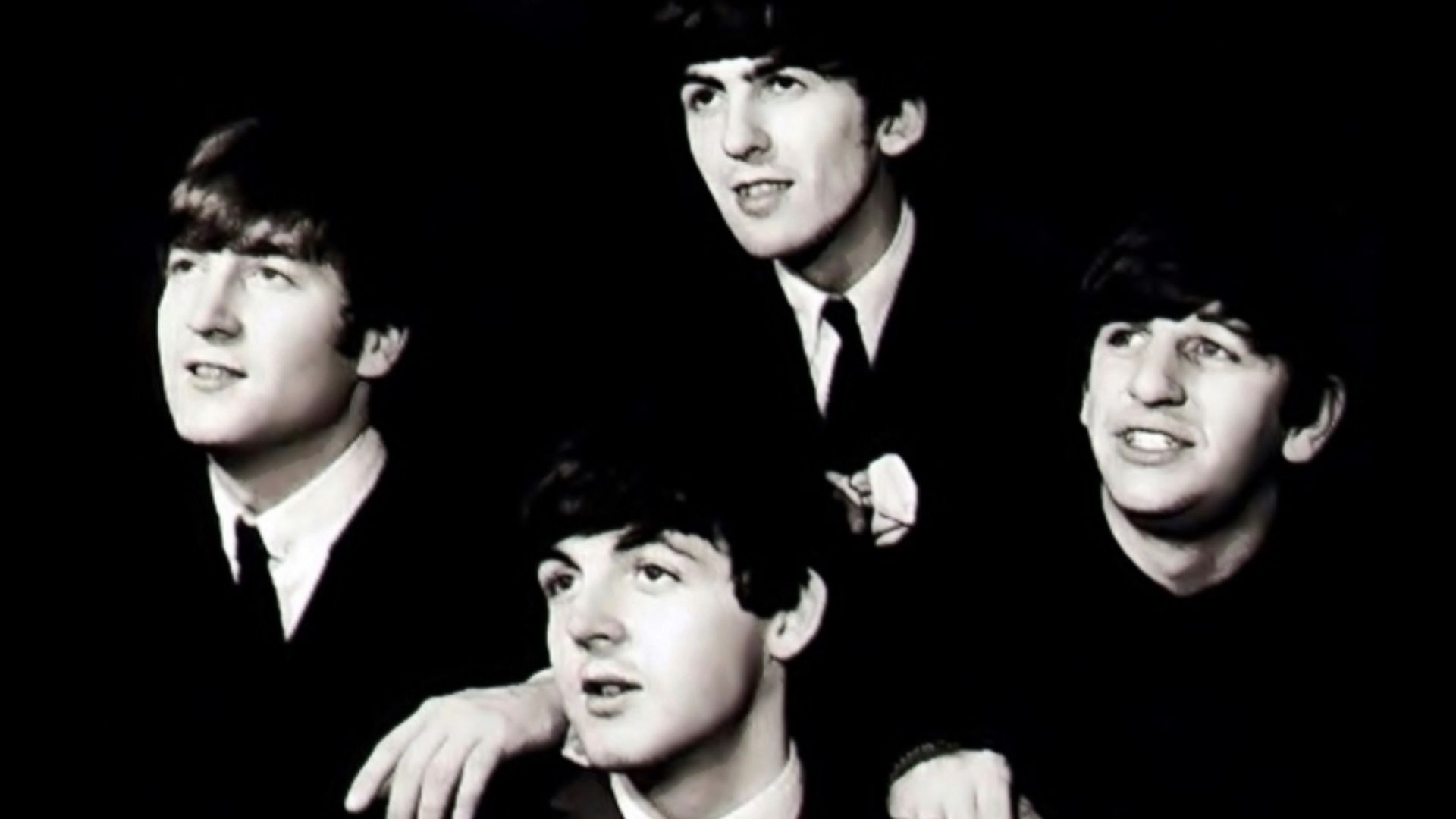 The Beatles in black background