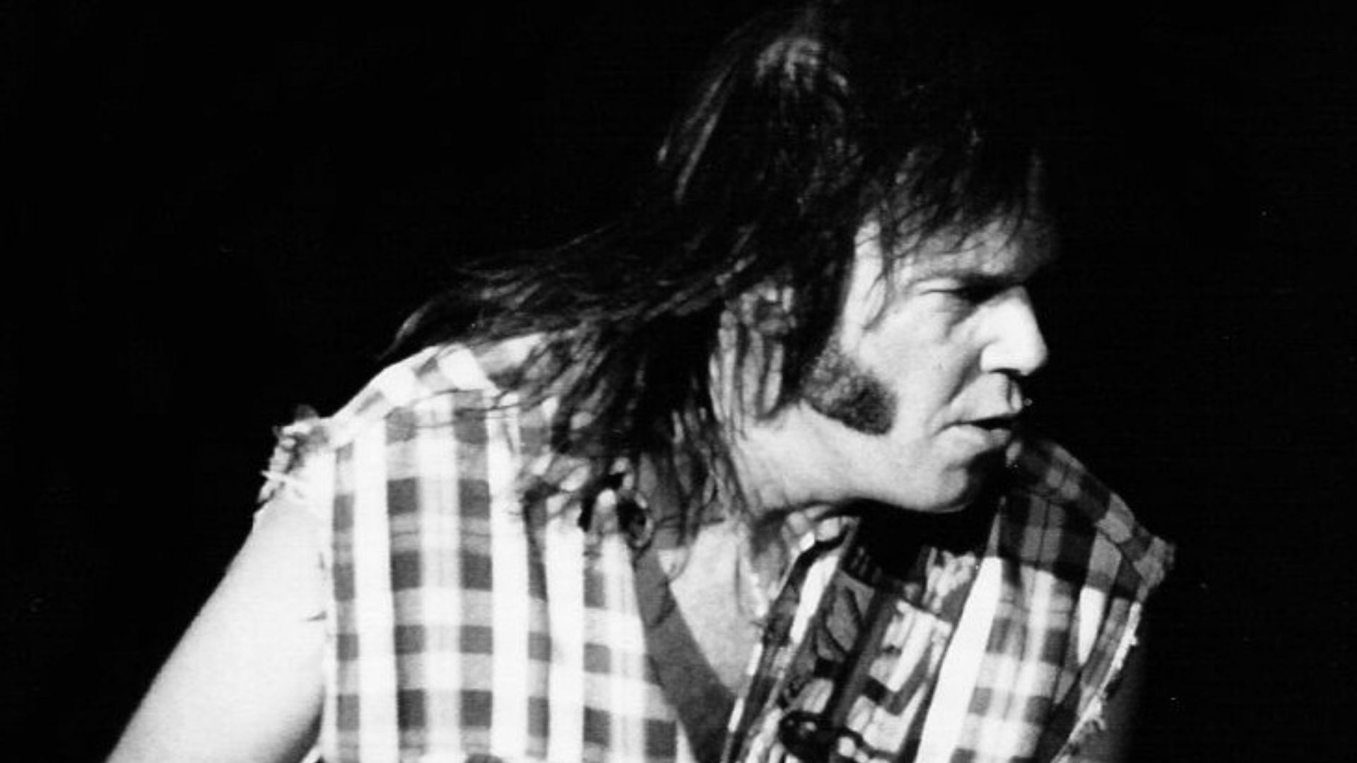 Neil Young performing with Crazy Horse in Barcelona