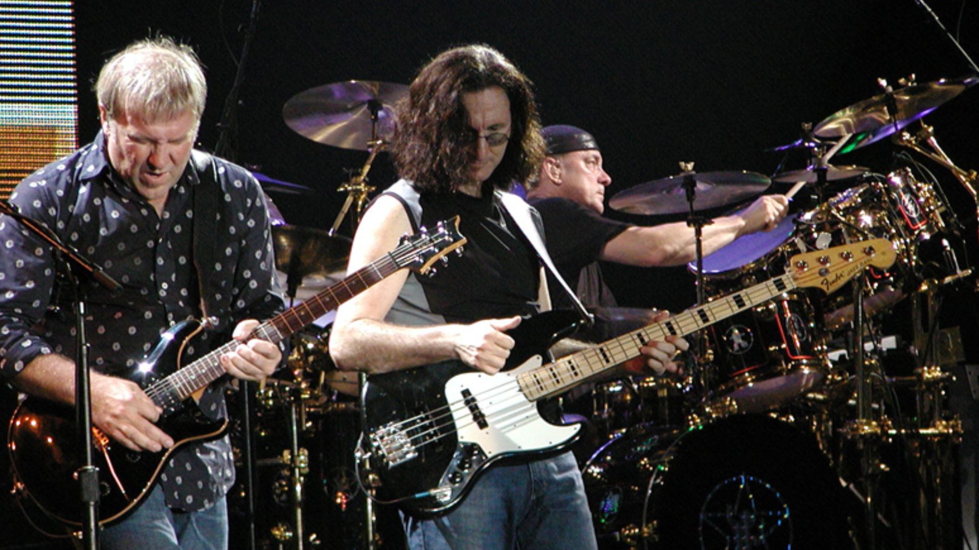Peart (right) performing with Rush.