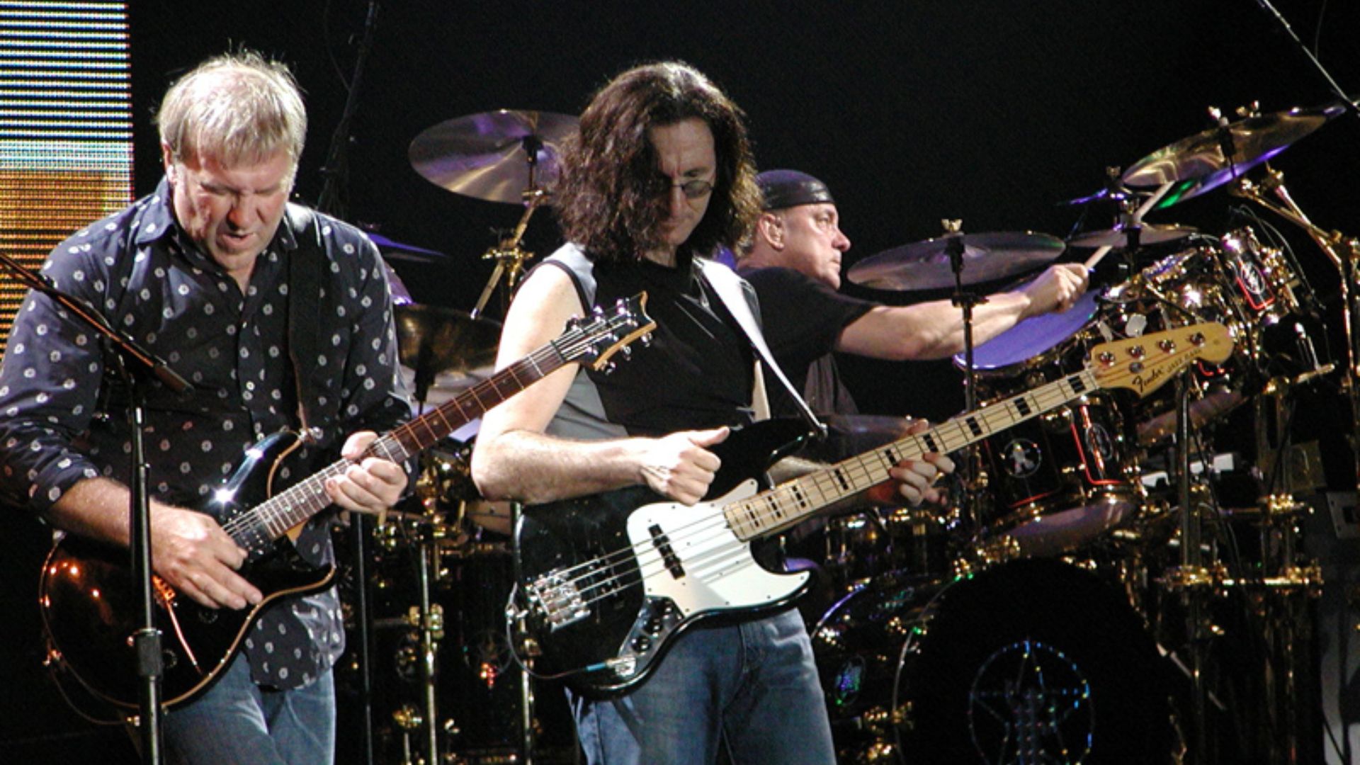Peart (right) performing with Rush.