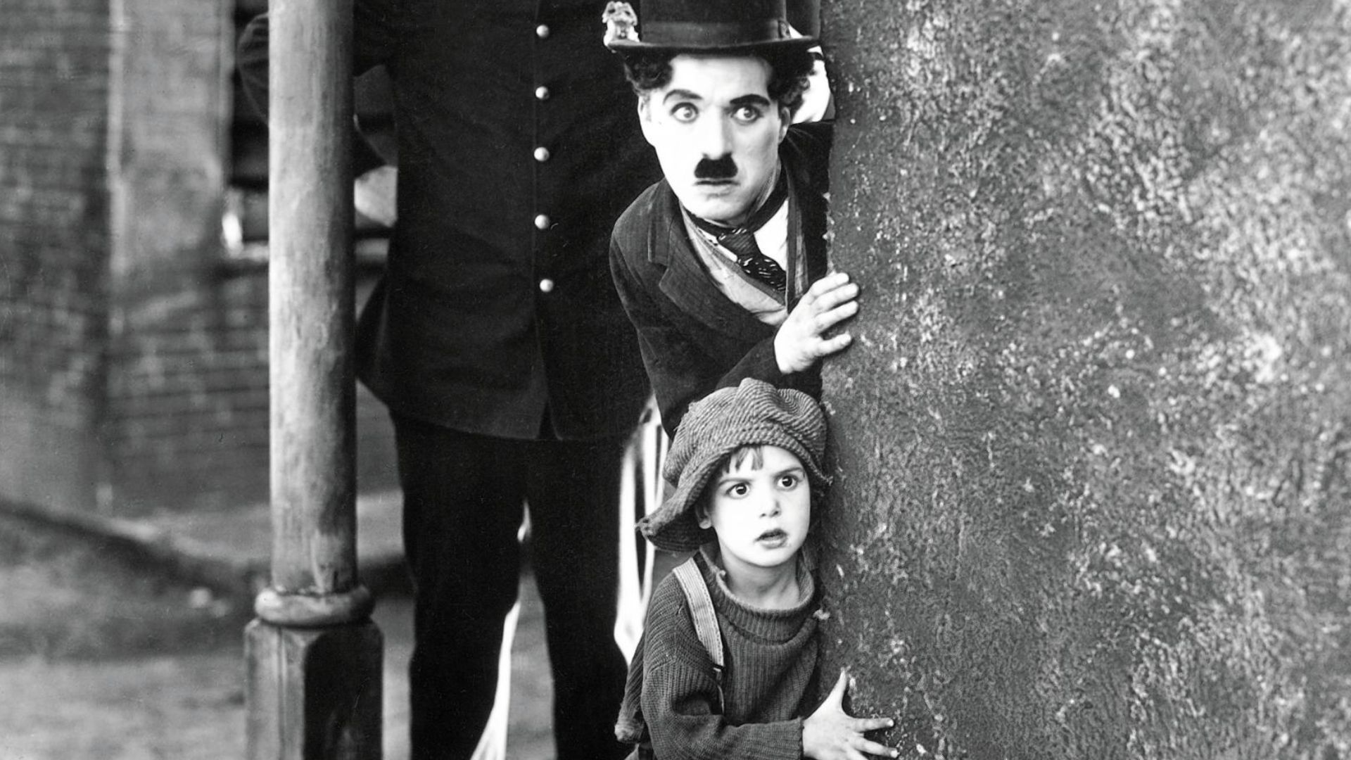 Publicity photo from Charlie Chaplin's The Kid.Shown (from front to back): Jackie Coogan as