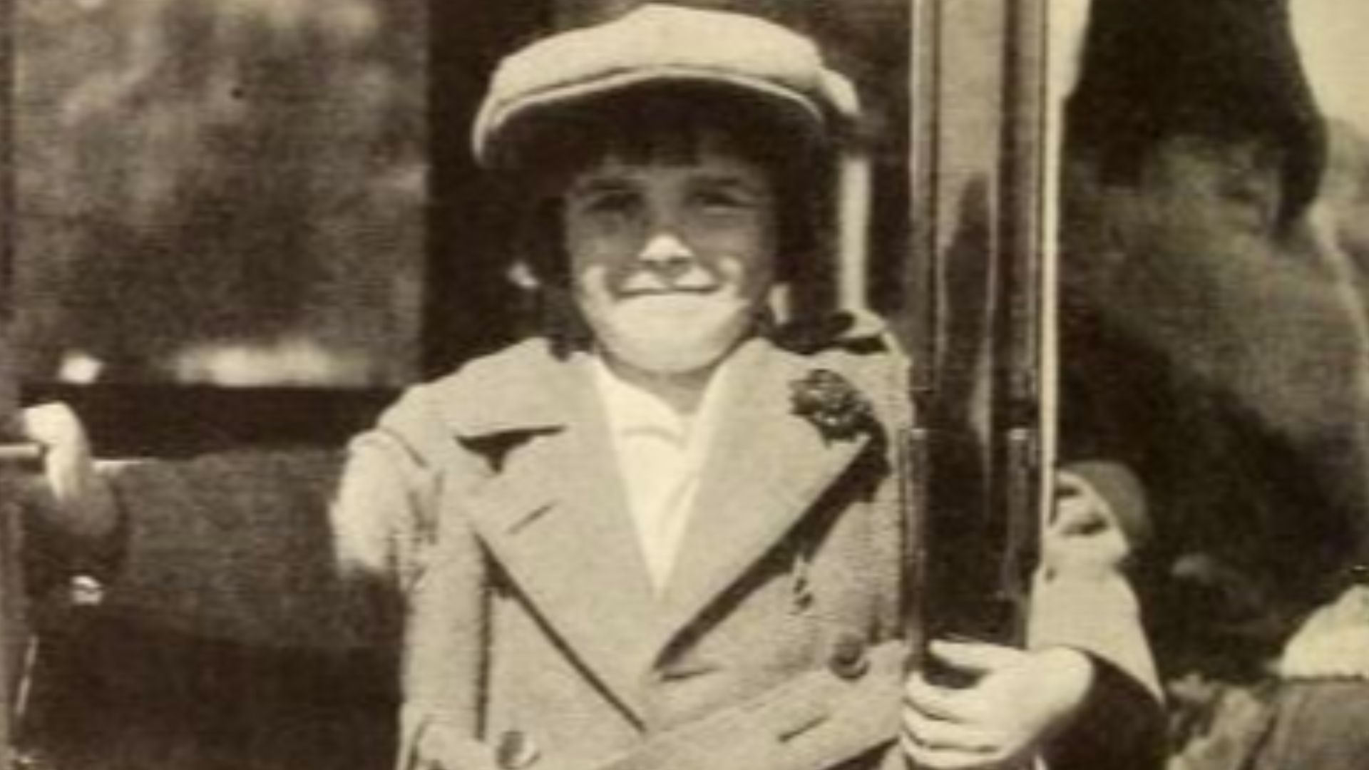 American actor Jackie Coogan in a Velie sedan that was purchased by his earnings, his mother is at the wheel. Page 92 November 1921 Photoplay.