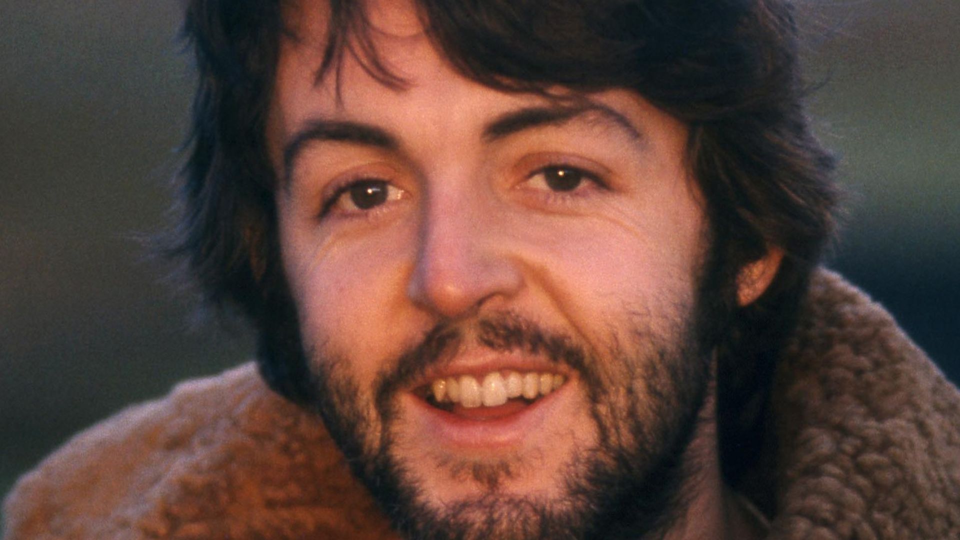 Paul McCartney with his baby, Mary, in 1969. The photograph was taken in Scotland by his wife Linda, and is public domain as it was released by Apple Records without a copyright tag.
