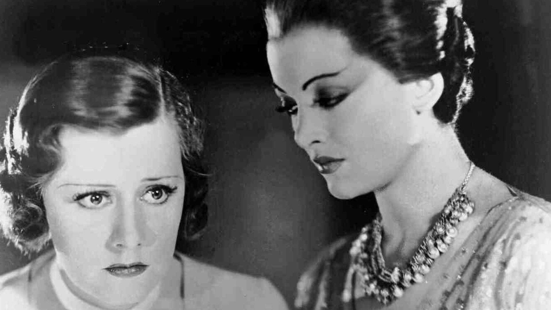 Irene Dunne and Myrna Loy in a promotional still for Thirteen Women (1932)