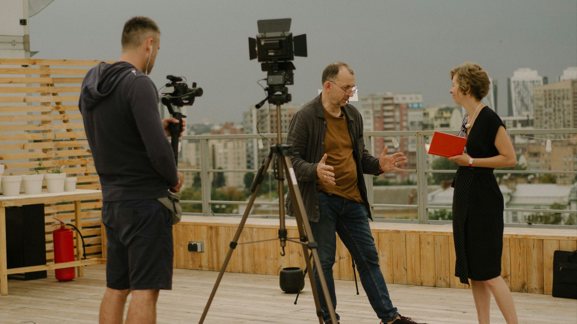 a group of people standing on top of a wooden floor