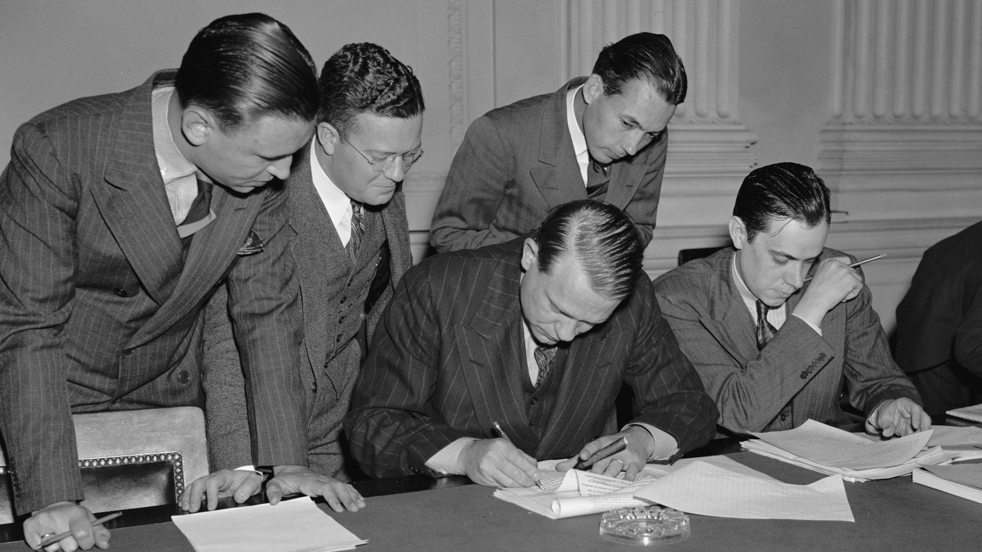 While newsmen take notes, Chairman Dies of House Committee investigating Un-American activities, proofs & reads his statement replying to Pres. Roosevelt's attack on the Committee, Oct. 26, 1938