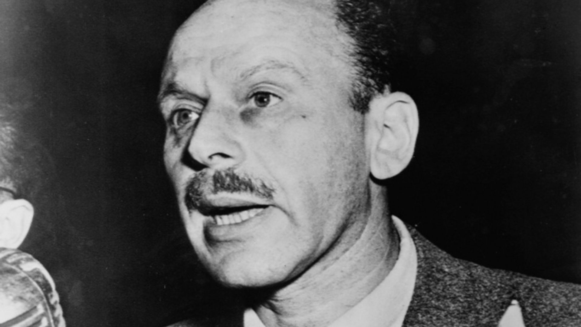 Alvah Bessie, Hollywood screen writer, head-and-shoulders portrait, facing left, testifying before the House Un-American Activities Committee
