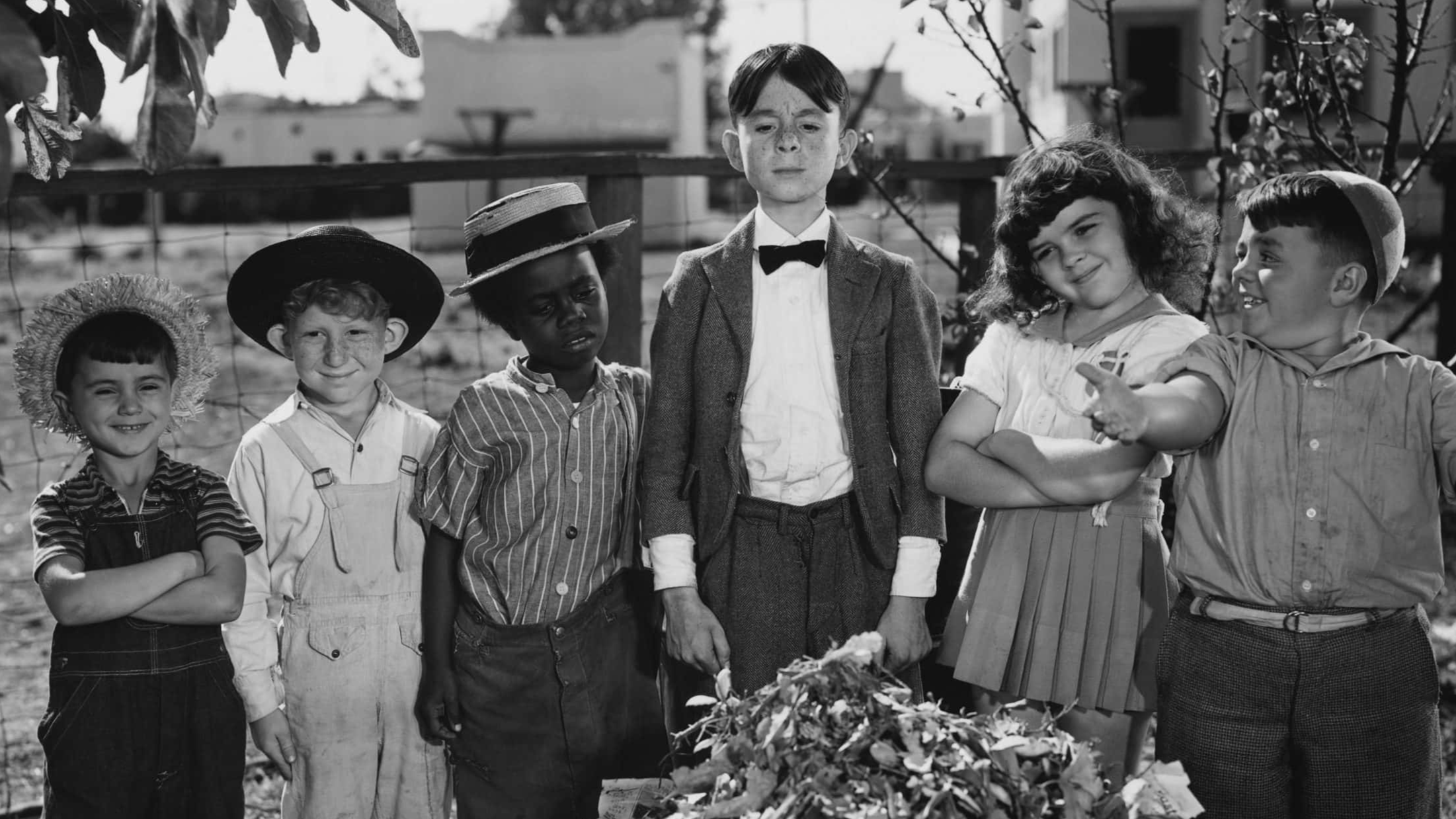 Publicity Still for Alfalfa's Double Spanky and the other gang members proudly show Cornelius Smythe, whom they think is Alfalfa, the clean yard. Gang members from left: Mickey (Robert Blake), Percy (Leonard Landy), Buckwheat (Billie Thomas), Cornelius Smythe (Carl 'Alfalfa' Switzer), Darla (Darla Hood), and Spanky (George McFarland).