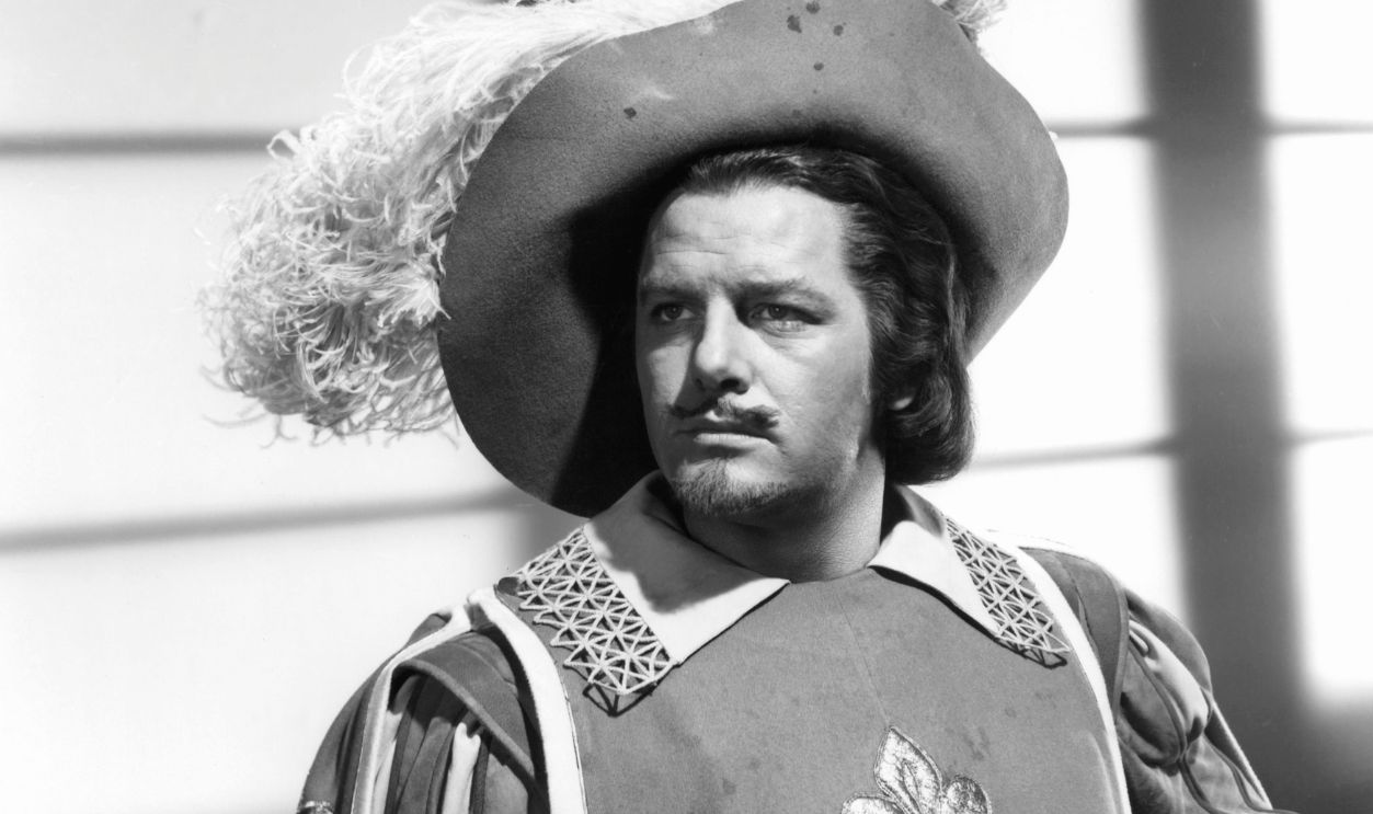 Gig Young holding sword in publicity portrait for the film 'The Three Musketeers', 1948.
