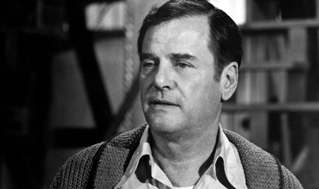 Gig Young looks on in a scene from the movie 