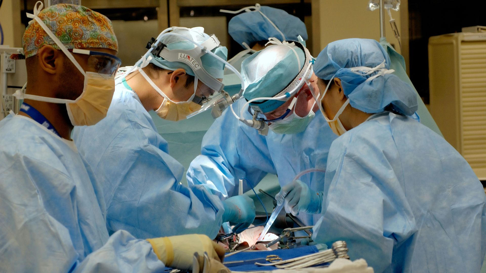 man in white dress shirt wearing white goggles