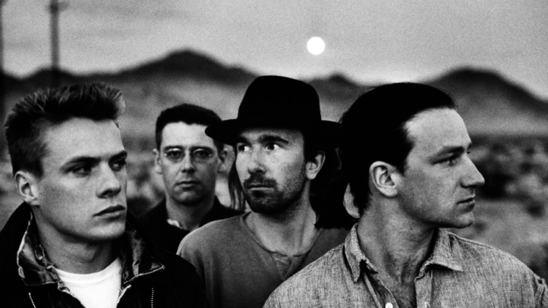 Irish band U2, in a 1987 publicity photo promoting its album The Joshua Tree, part of the photoshoot made by Anton Corbijn. From left to right: Larry Mullen, Adam Clayton, The Edge, Bono.