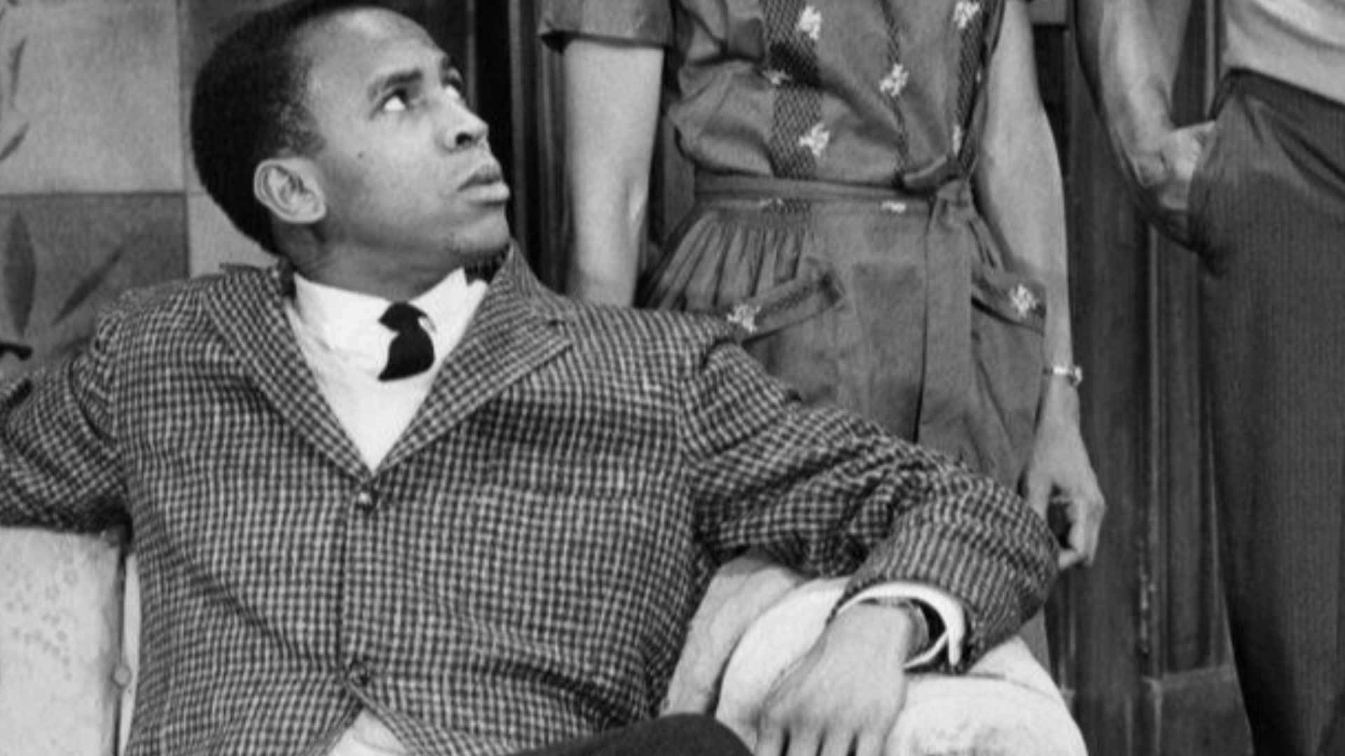 Photo of a scene from the play A Raisin in the Sun.  From left-Louis Gossett (George Murchison), Ruby Dee (Ruth Younger) and Sidney Poitier (Walter Younger). Everyone shown in the photo reprised their roles in the 1961 film.