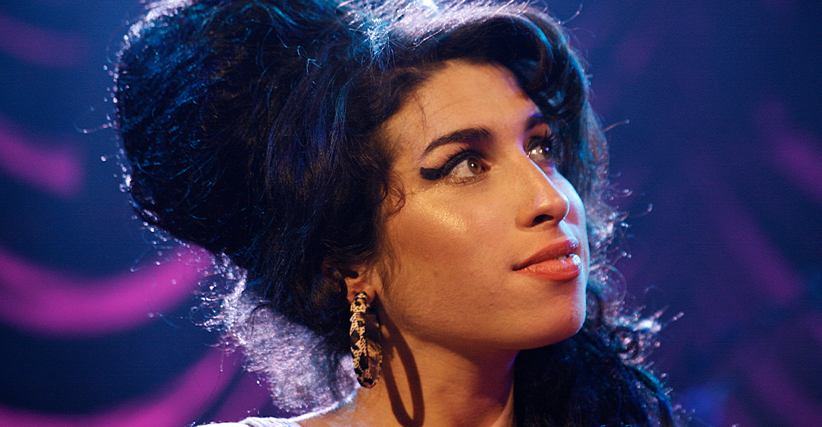 Amy Winehouse performing on stage 