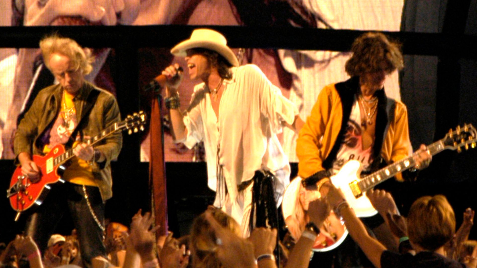Brad Whitford, Steven Tyler, and Joe Perry of Aerosmith performing at the NFL Kickoff in Washington, DC on September 4, 2003.