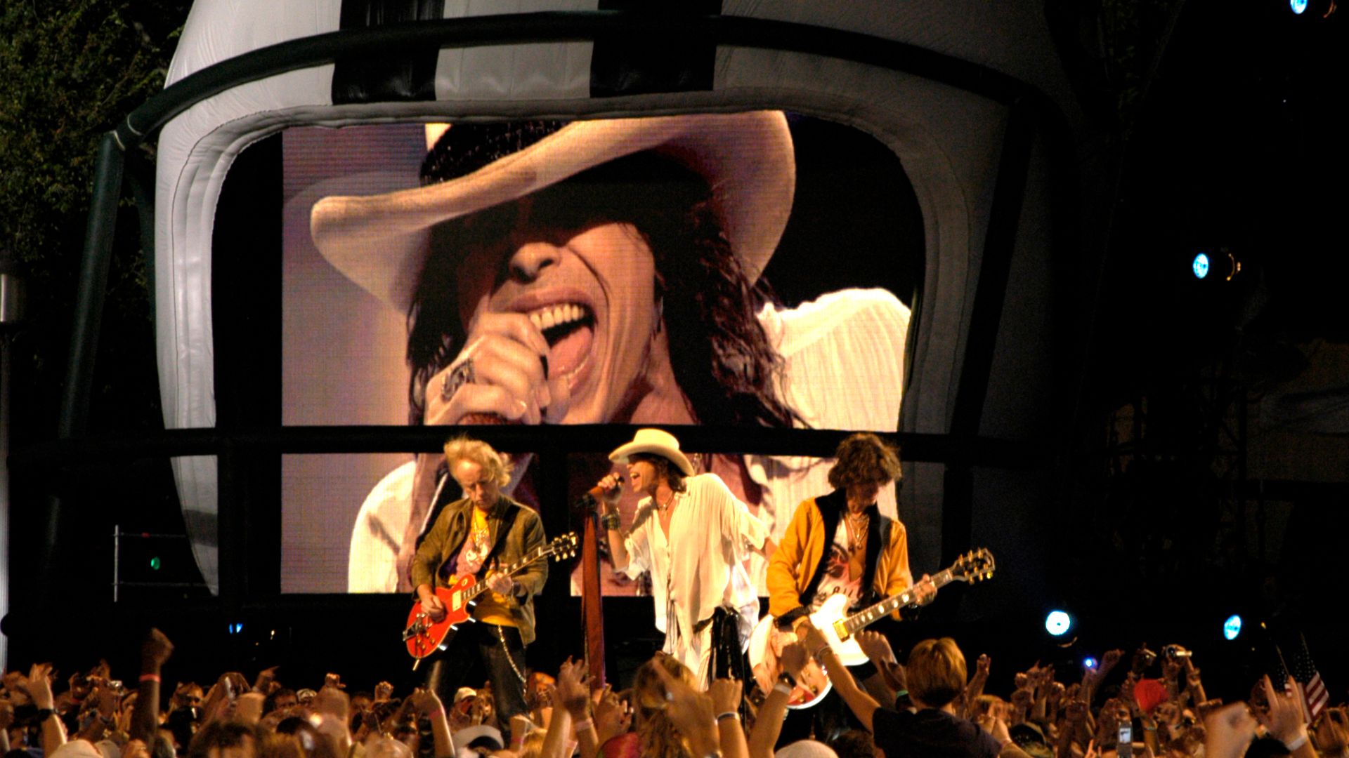 Washington D.C. (Sept. 4, 2003) -- Aerosmith performs on stage during the Operation Tribute to Freedom, NFL and Pepsi sponsored “NFL Kickoff Live 2003” Concert on the Mall.  Organizers provided priority seating for military members and their families. Among the other performers were Britney Spears, Aretha Franklin, Mary J. Blige and Good Charlotte. Operation Tribute to Freedom (OTF) was set up by the Department of Defense as a way for Americans to show their appreciation to our men and women in uniform.   U.S. Navy photo by Photographer's Mate 2nd Class Rob Rubio (RELEASED)