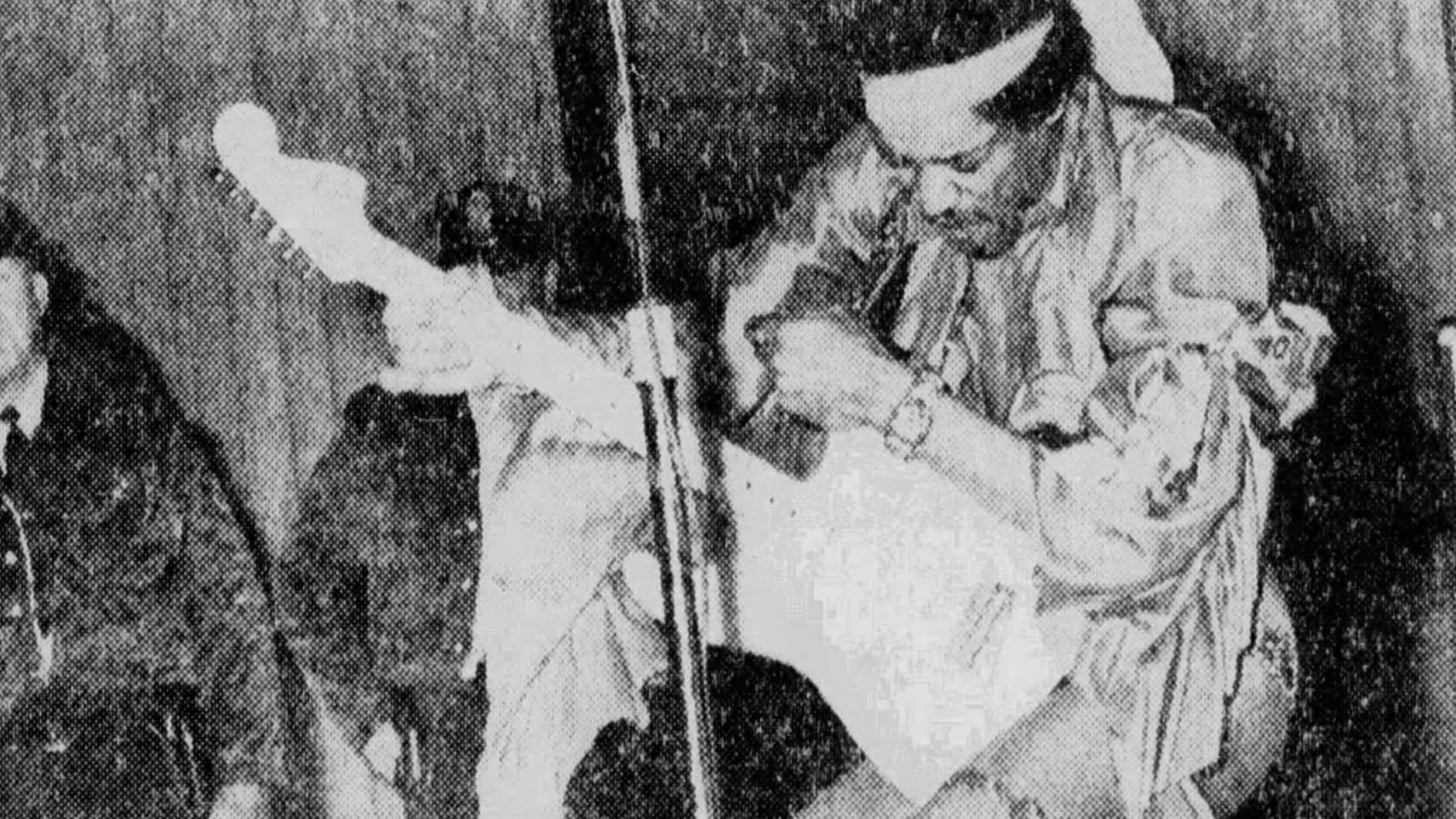 Photograph of Jimi Hendrix performing at the Ellis Memorial Auditorium in Memphis, TN. Taken from The Commercial Appeal newspaper, April 19, 1969.