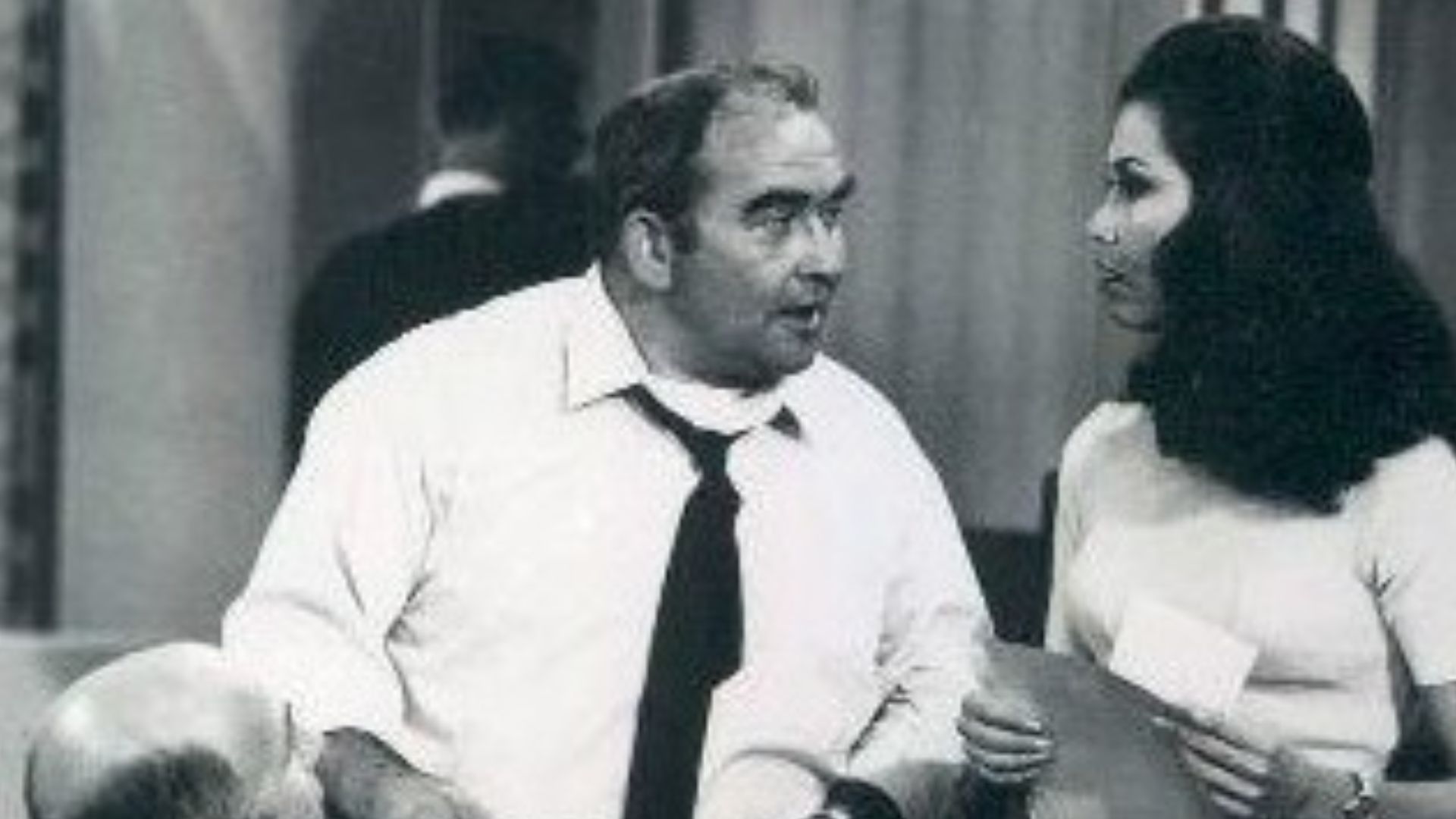 Photo scene from the television program The Mary Tyler Moore Show of Gavin MacLeod (Murray Slaughter), Ed Asner (Lou Grant), and Mary Tyler Moore in the station's newsroom.  *Note - this came from a press release dated 1977. The scene is from a 1970 episode.*