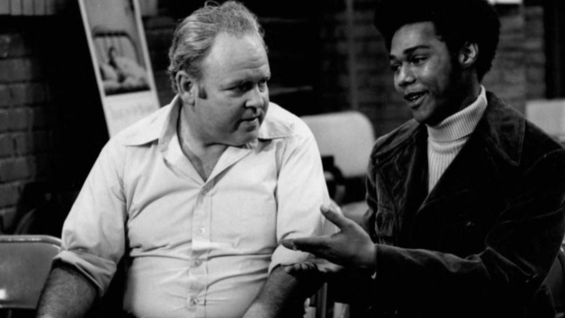 Publicity photo from the television program All in the Family.  Pictured are Carroll O'Connor (Archie Bunker) and Michael Evans (Lionel Jefferson).  In this episode, Archie visits a local blood bank to donate and meets his neighbor, Lionel Jefferson, who is also there to donate.