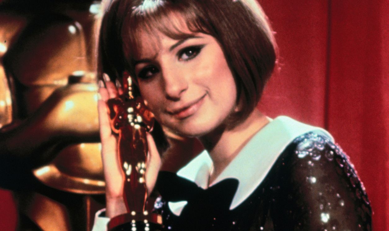 Barbara Streisand Hugging Oscar Barbara Streisand holds the Oscar she won for Funny Girl.