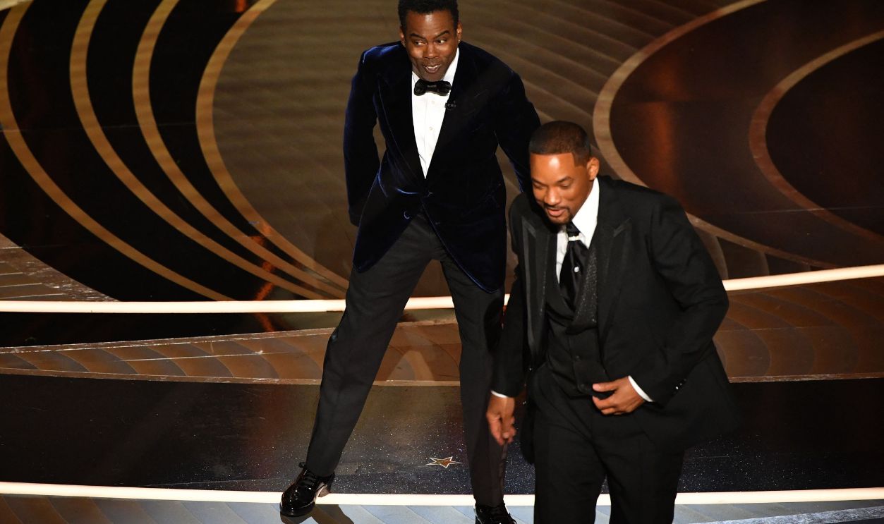 US-ENTERTAINMENT-FILM-OSCARS-SHOW US actor Will Smith (R) walks away from US actor Chris Rock onstage during the 94th Oscars at the Dolby Theatre in Hollywood, California on March 27, 2022.