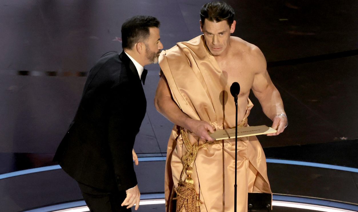 96th Annual Academy Awards - Show HOLLYWOOD, CALIFORNIA - MARCH 10: (L-R) Host Jimmy Kimmel and John Cena speak onstage during the 96th Annual Academy Awards at Dolby Theatre on March 10, 2024 in Hollywood, California.