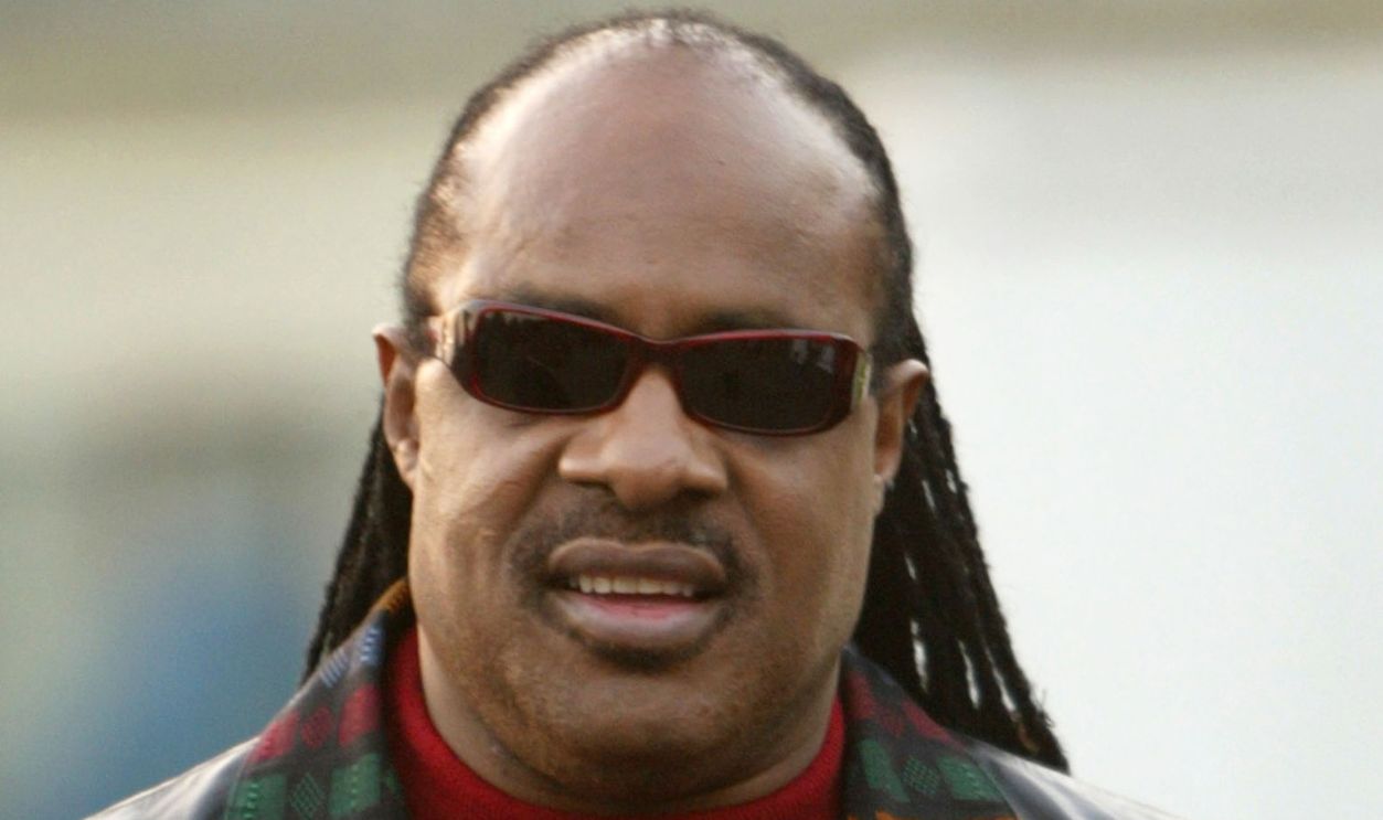 Getty Images - 2882048 - Singer Stevie Wonder makes a surprise appearance at a 100,000 Man March rally to celebrate Martin Luther King day on January 19, 2004 in Los Angeles, California. The rally paid tribute to citizens who dedicated, and sometimes, lost their lives to violence, in the pursuit of domestic tranquility and served as the official launch of the Passage to Peace Project, aimed at stopping violence in Los Angeles.