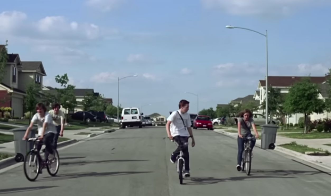 Arcade Fire—The Suburbs Directed by Spike Jonze, The Suburbs captures the weird mix of freedom and anxiety that comes with growing up. Kids ride bikes through quiet neighborhoods while hints of authority and tension creep into the story. The imagery feels nostalgic but slightly uneasy. It plays like a coming-of-age indie movie condensed into a few minutes.