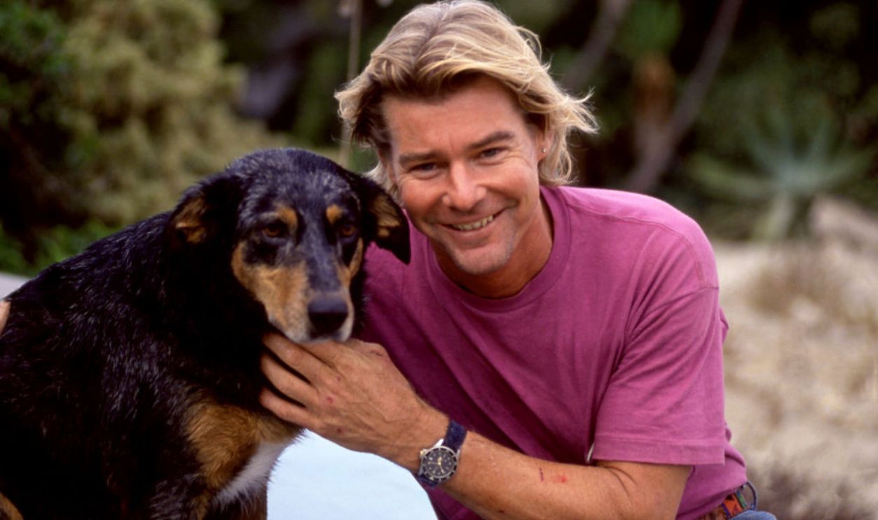 American actor Jan-Michael Vincent (1944-2019), poses for a portrait with his dog circa October, 1991 in Malibu, California.
