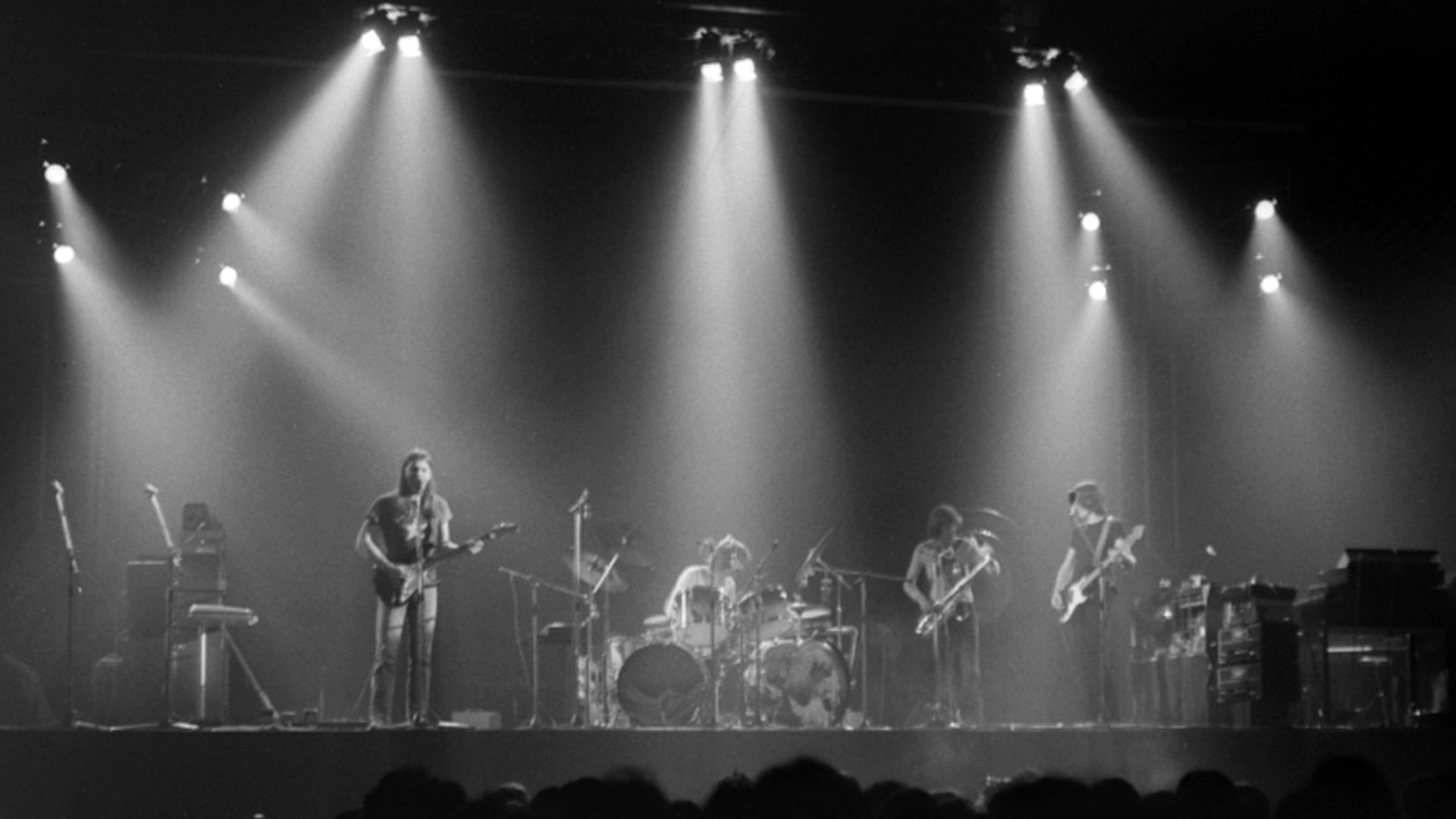 A live performance of The Dark Side of the Moon at Earls Court, shortly after its release in 1973: (l-r) Gilmour, Mason, Dick Parry, Waters