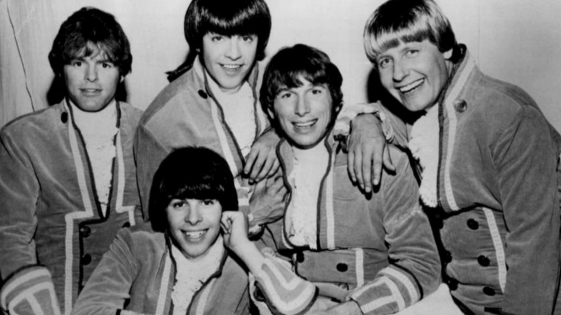 Photo of Paul Revere and the Raiders. Standing from left: Mike