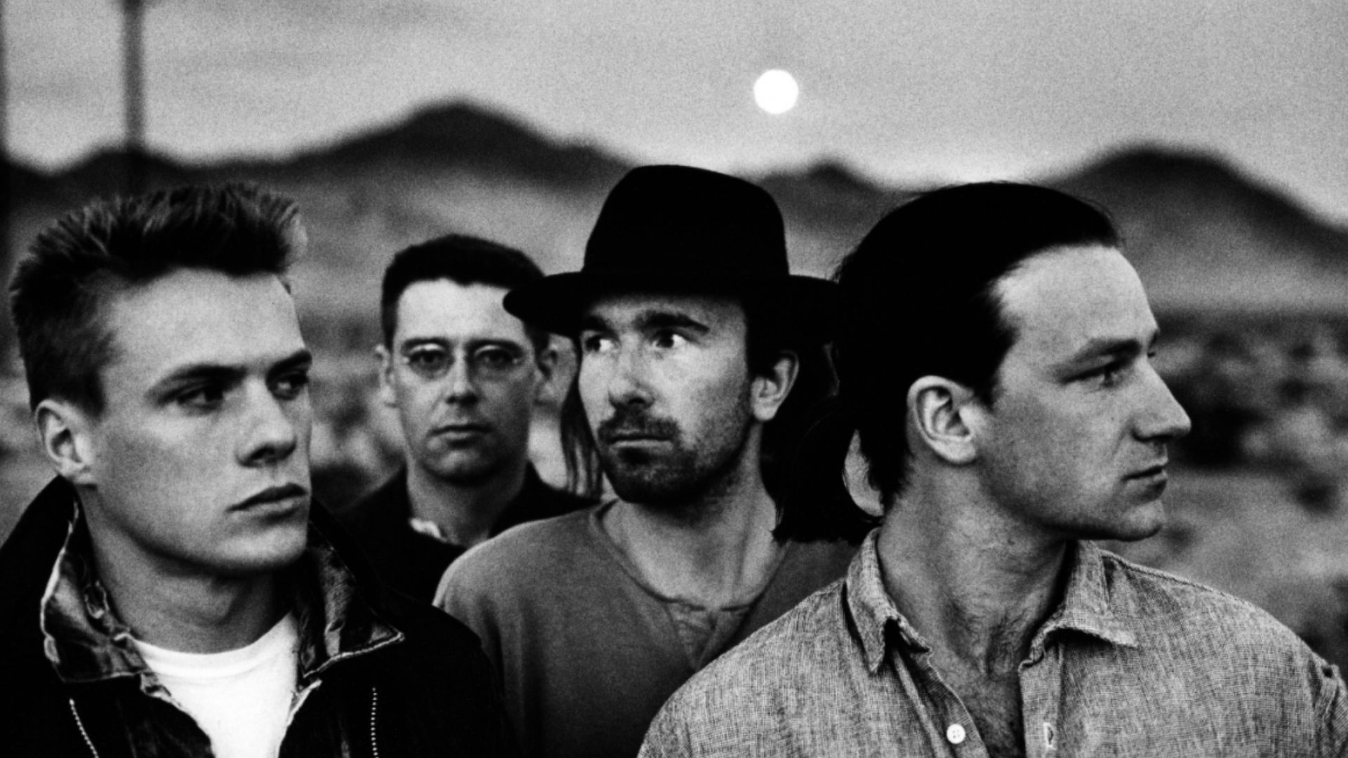 Irish band U2, in a 1987 publicity photo promoting its album The Joshua Tree, part of the photoshoot made by Anton Corbijn. From left to right: Larry Mullen, Adam Clayton, The Edge, Bono.