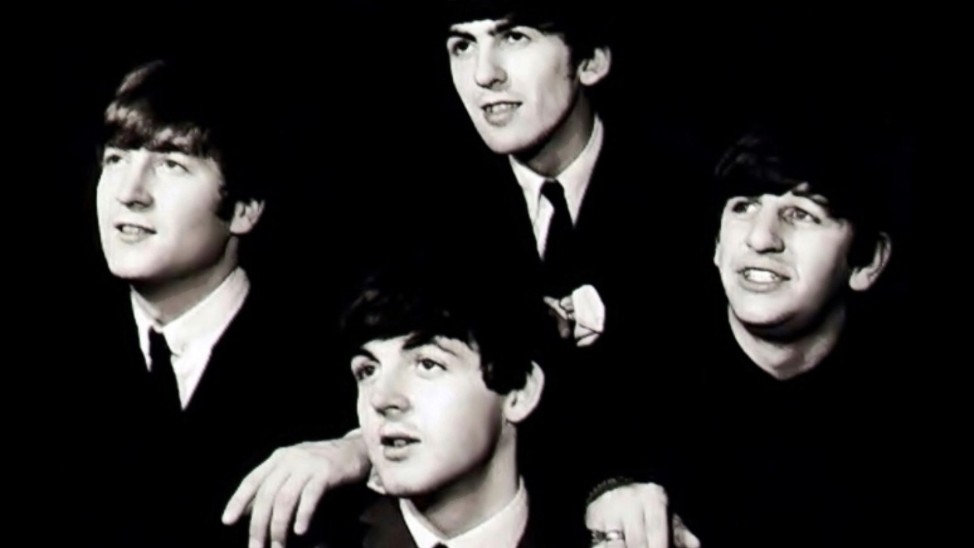 The Beatles in black background