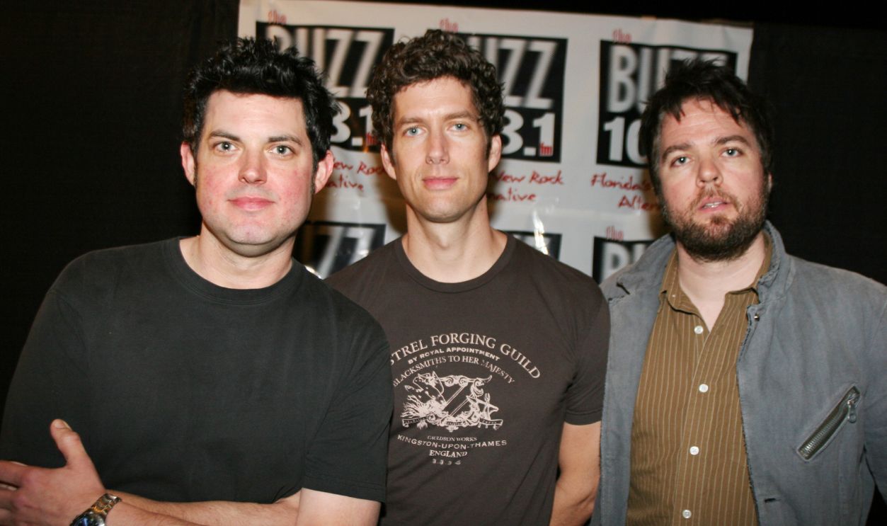 Better Than Ezra perform at the Hard Rock in Hollywood, FL. HOLLYWOOD, FL - FEBRUARY 16: (L to R) Tom Drummond, Kevin Griffin, and Travis McNabb of Better Than Ezra pose for photos just before taking the stage at the Seminole Paradise Hard Rock Hotel and Casino on February 16, 2005 in Hollywood, Florida. 
