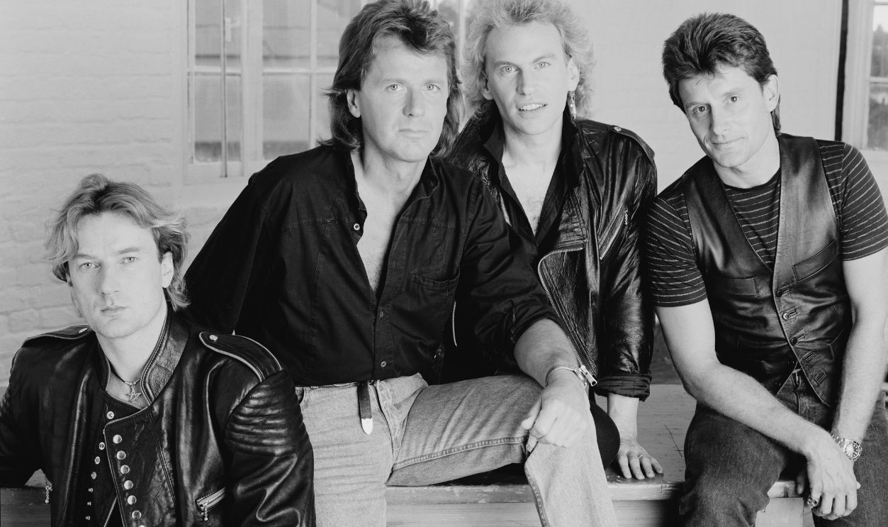 Asia English progressive rock band Asia, London 1990. Left to right: keyboard player Geoff Downes, bassist John Wetton (1949 - 2017), guitarist Pat Thrall and drummer Carl Palmer.