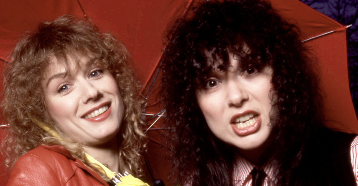 American musicians Nancy Wilson and Ann Wilson, of the American rock band Heart, pose for a portrait under an umbrella in Los Angeles, California, March 1980. 