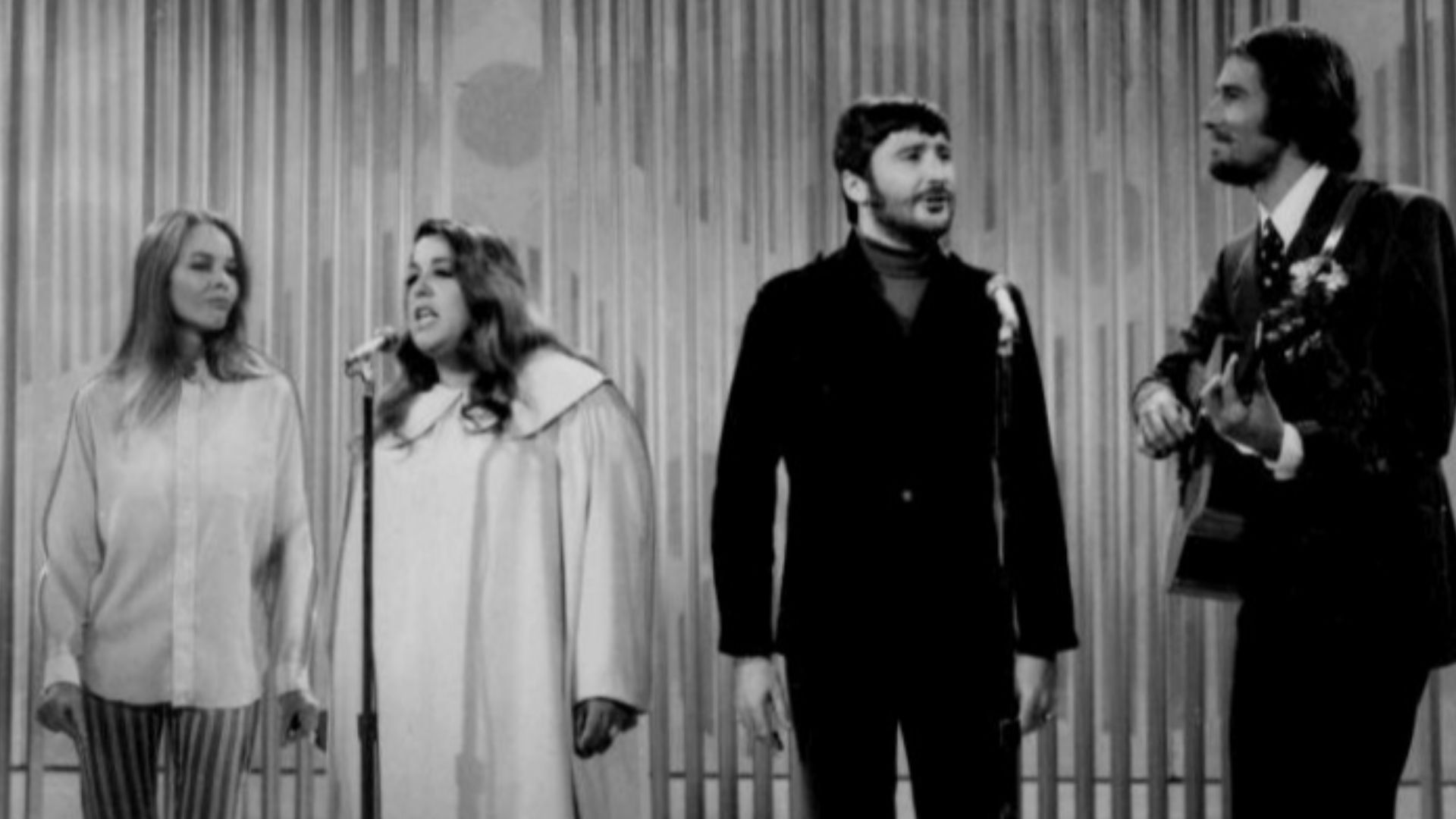 Photo of The Mamas and the Papas performing on The Ed Sullivan Show. From left-Michelle Phillips, Cass Elliot, Denny Doherty, and John Phillips.