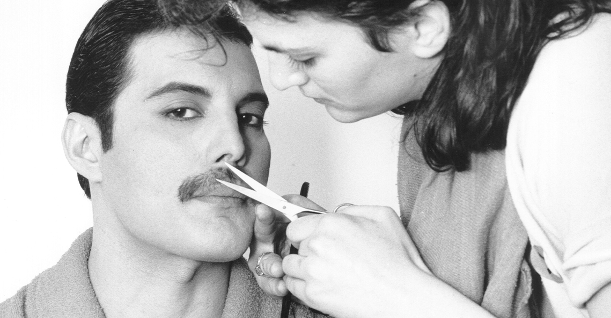 Freddie Mercury getting his moustache trimmed