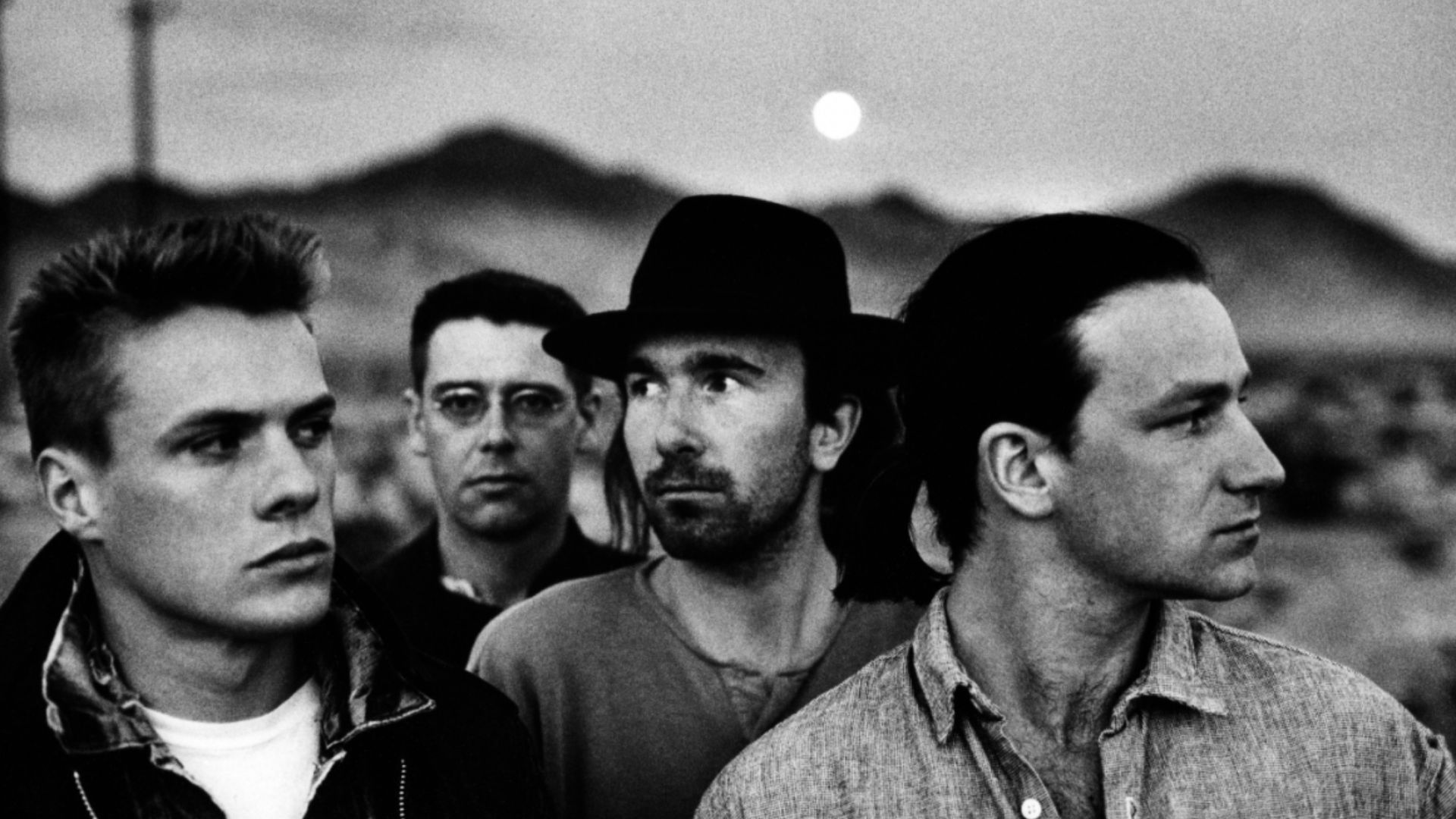 Irish band U2, in a 1987 publicity photo promoting its album The Joshua Tree, part of the photoshoot made by Anton Corbijn. From left to right: Larry Mullen, Adam Clayton, The Edge, Bono.