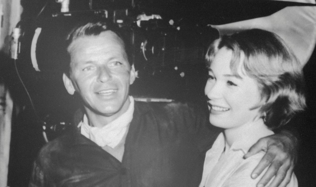 Shirley MacLaine with Frank Sinatra (Original Caption) Actress Shirley MacLaine and singer Frank Sinatra on set during filming of Sergeants 3.