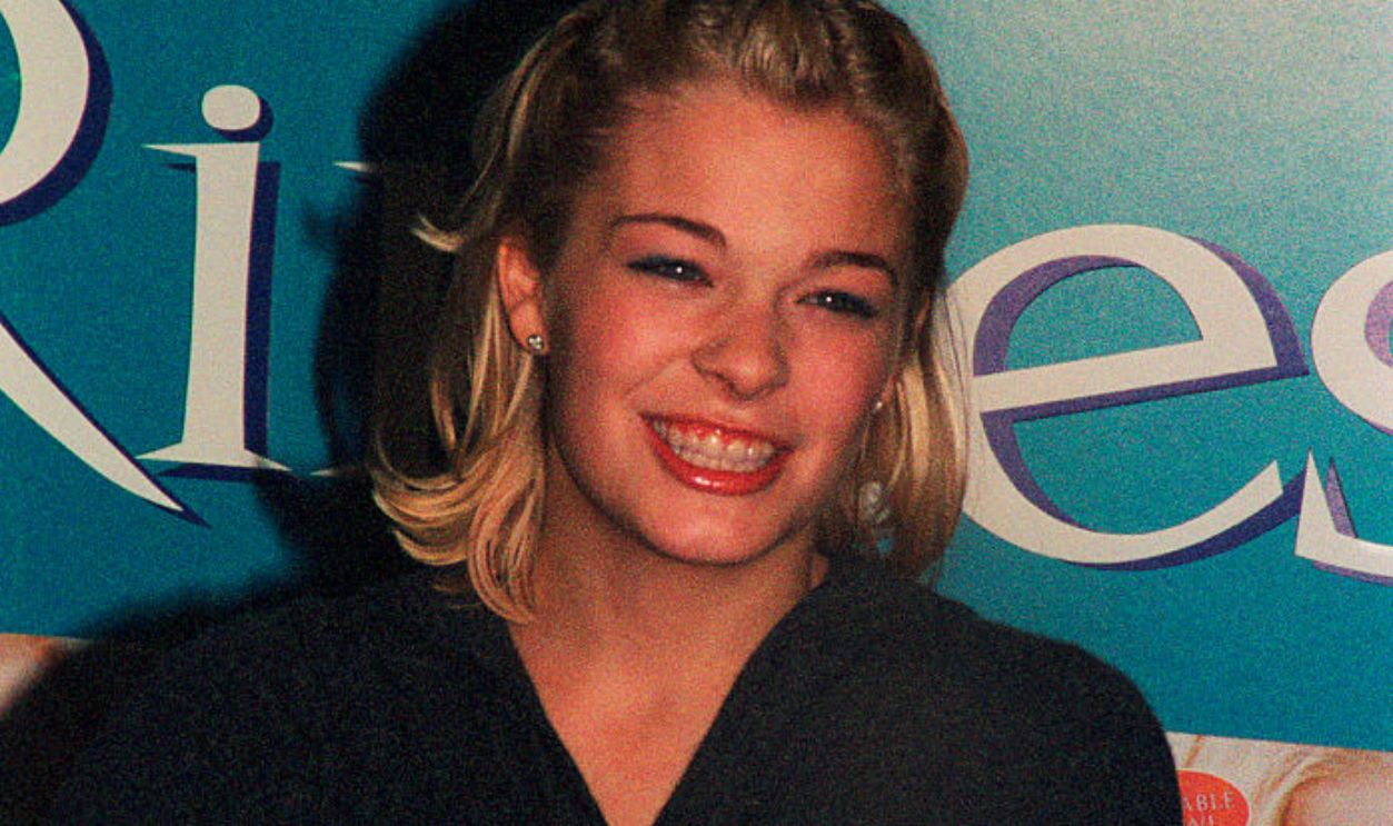 LeAnn Rimes, country pop singer with one of her CD's; circa 1980; New York.