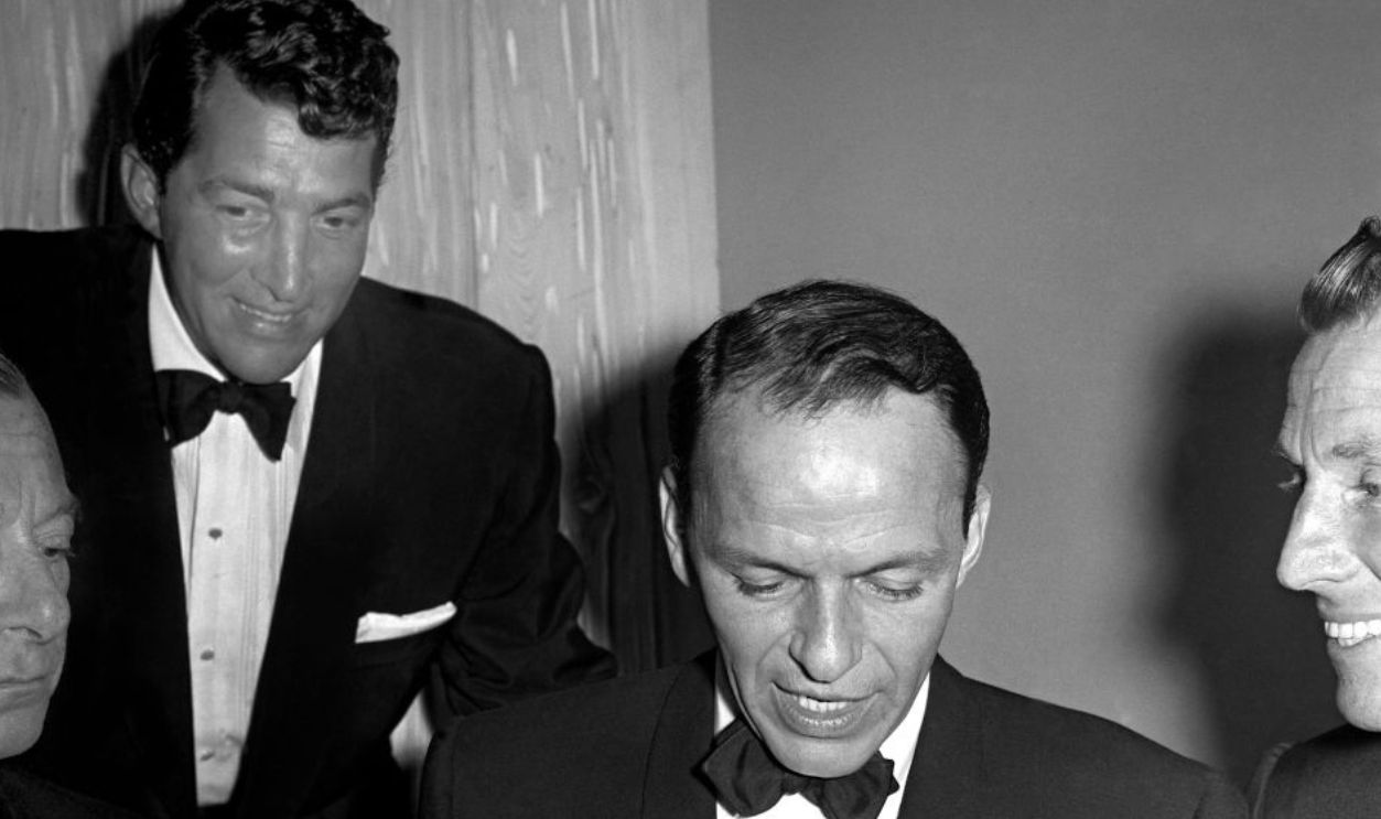 Rat Pack Members At Friar's Club Dinner BEVERLY HILLS - FEBRUARY 14: Singers and Rat Pack members Frank Sinatra and Dean Martin attend a Friar's Club dinner on February 14, 1957 in Los Angeles, California.