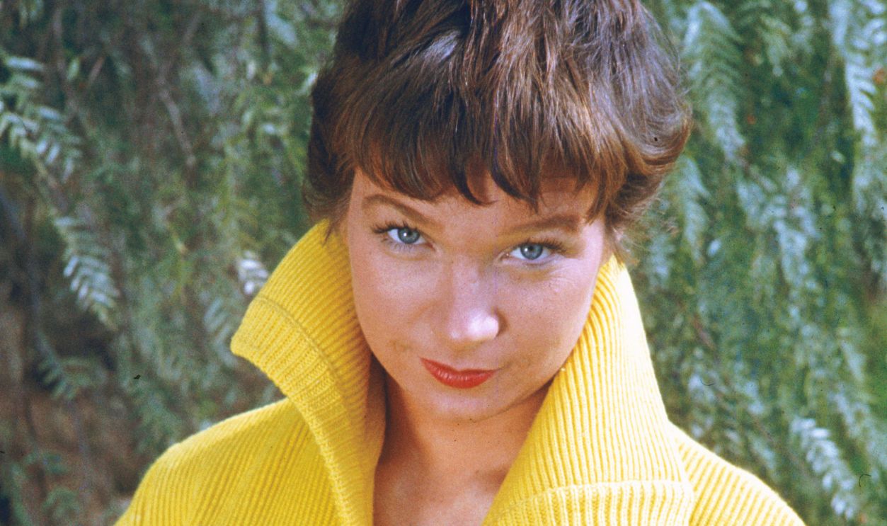 Shirley MacLaine American actress Shirley MacLaine in a yellow cardigan, circa 1960.