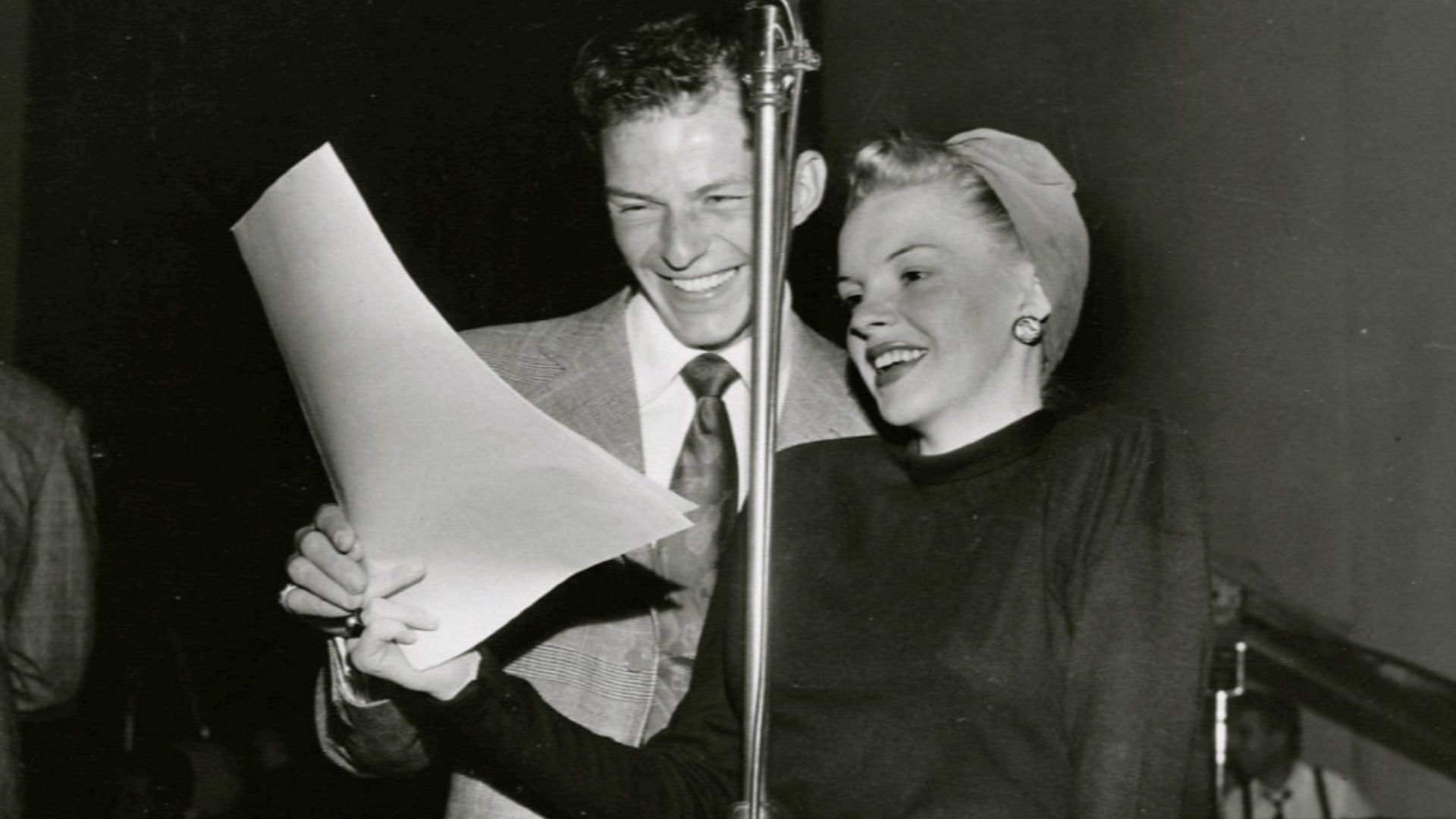 Photo of Frank Sinatra and Judy Garland as guest hosts of the Danny Kaye radio program.  Kaye was on a USO tour at the time and asked friends to guest host his weekly radio show while he was away.