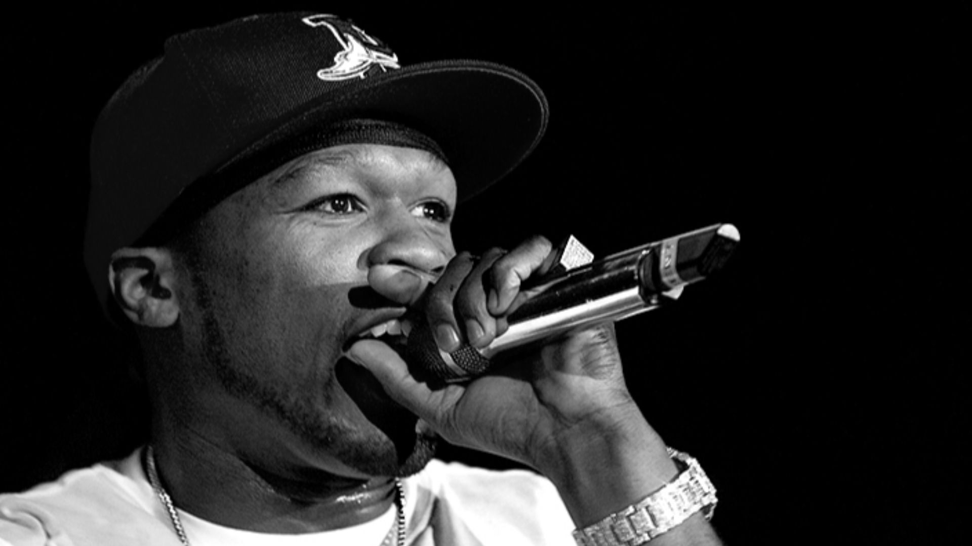 Rapper 50 Cent in concert sporting Bling-Bling