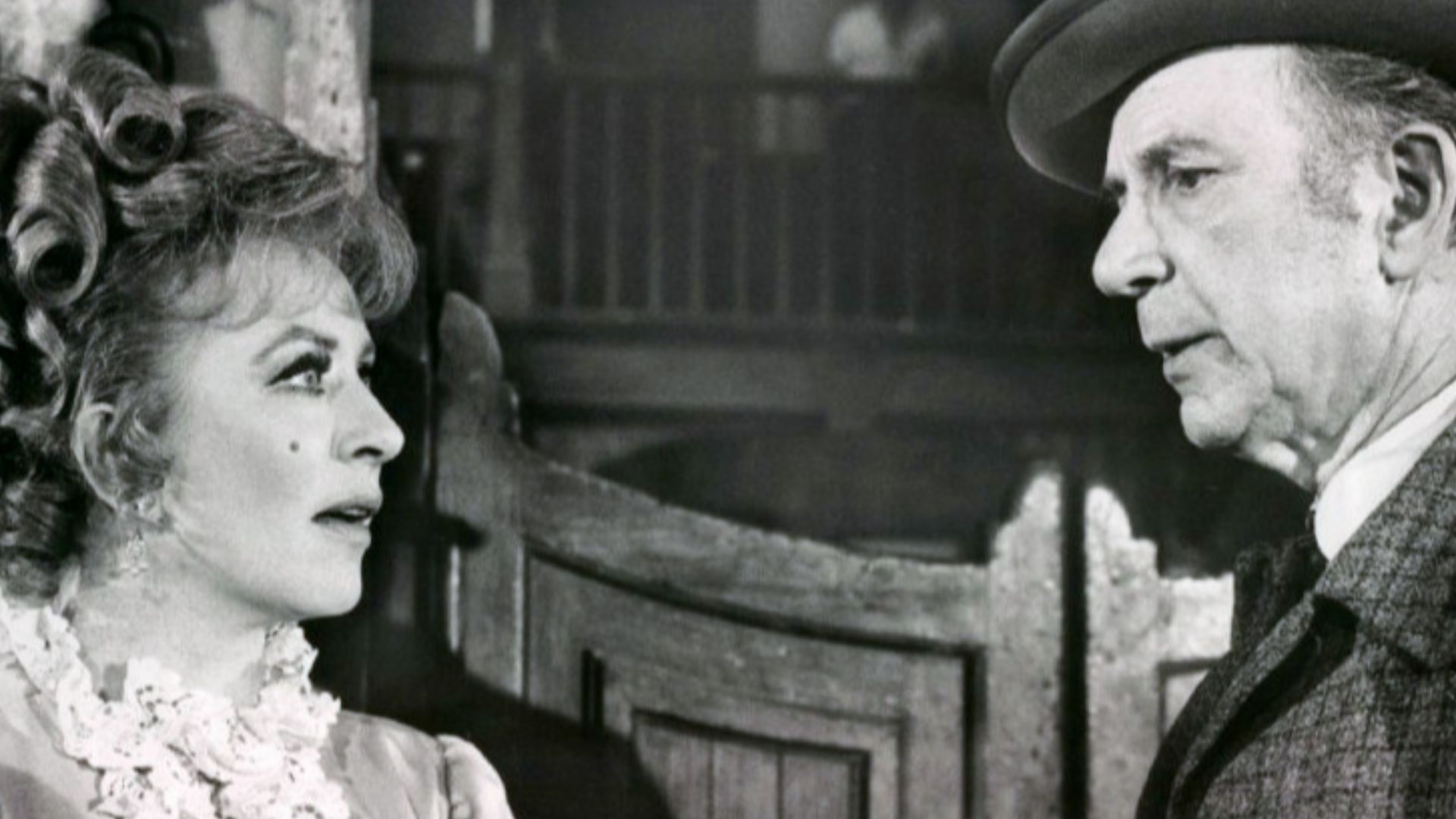 Photo of Amanda Blake as Kitty Russell and guest star Jack Albertson from the television program Gunsmoke.