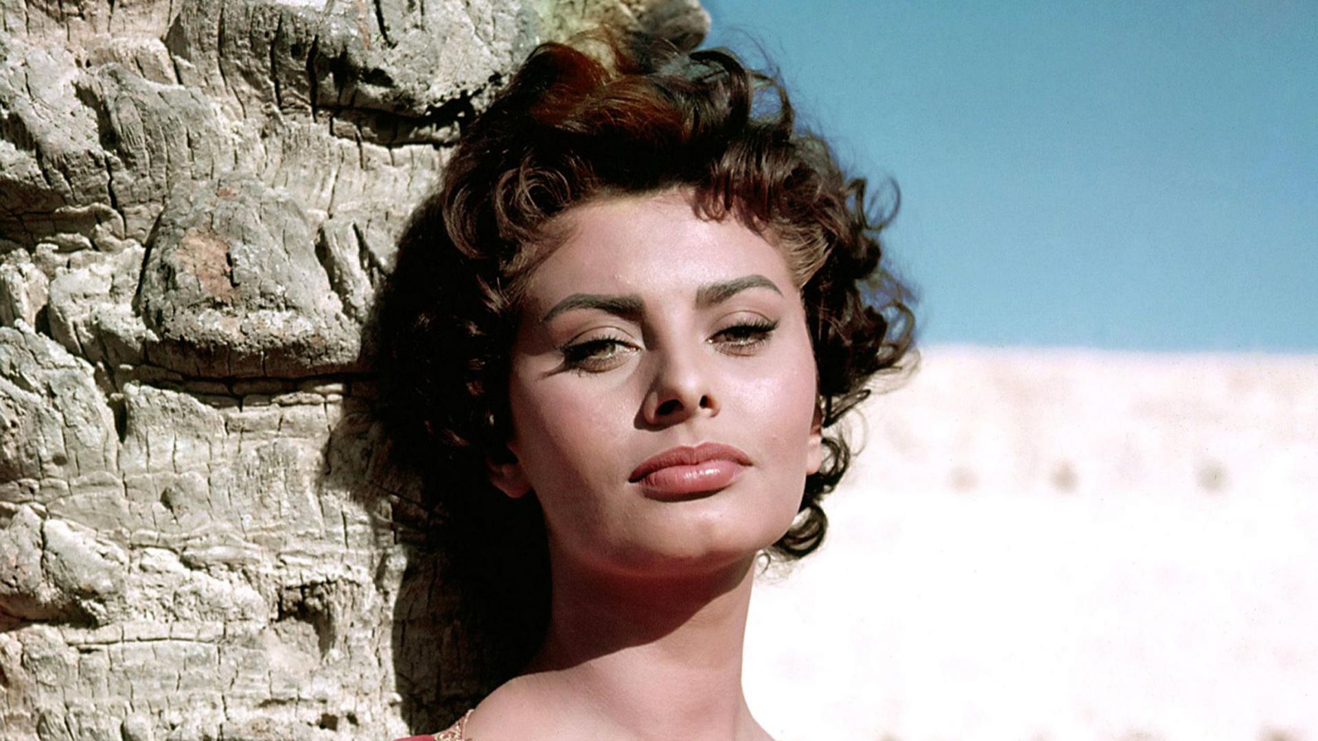 Sophia Loren posing in a publicity photo for the 1957 film Legend of the Lost. The color photo was published as a coloroto in the New York Sunday News on September 1, 1957