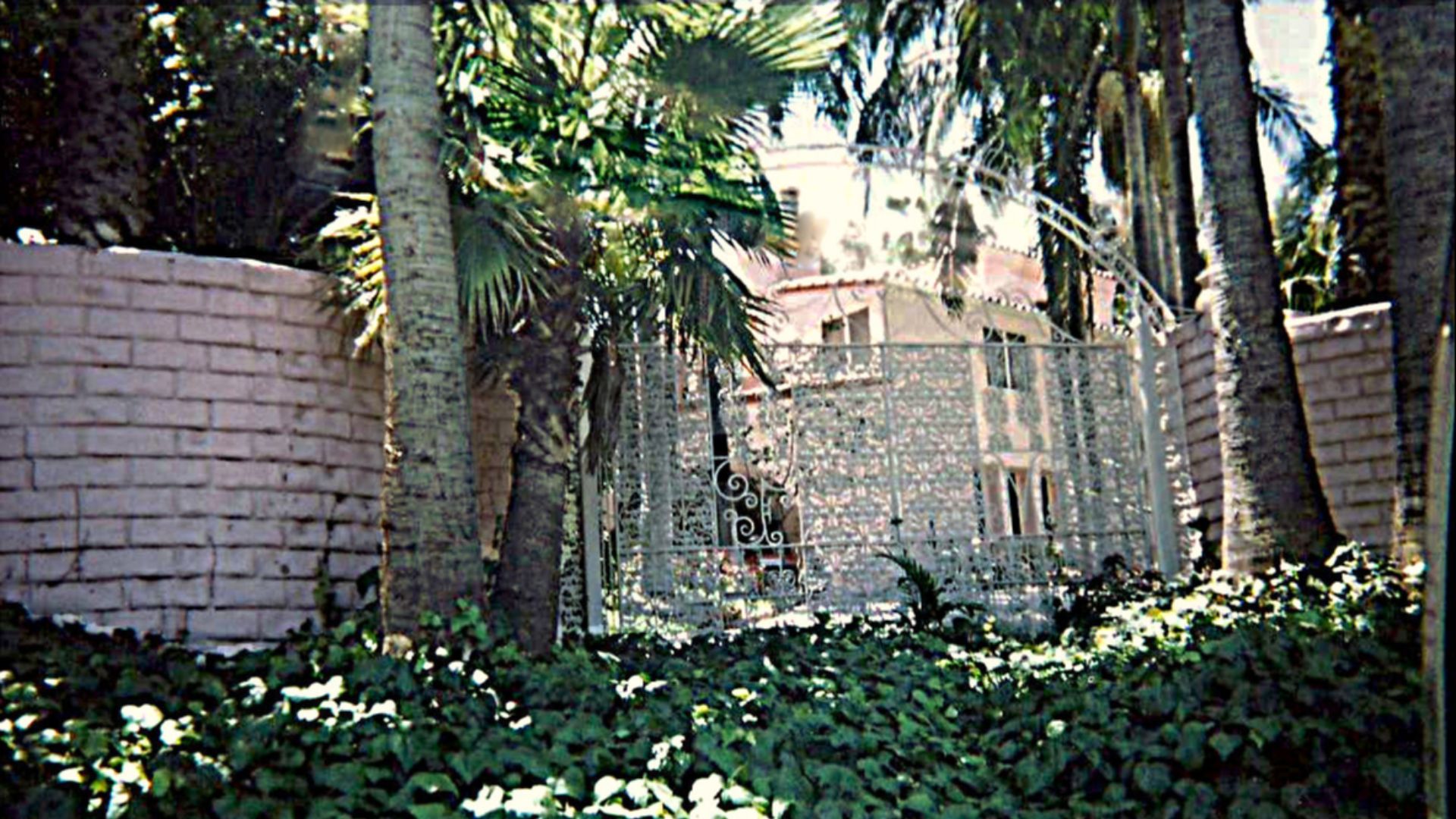 Gate and glimpse of exterior of the