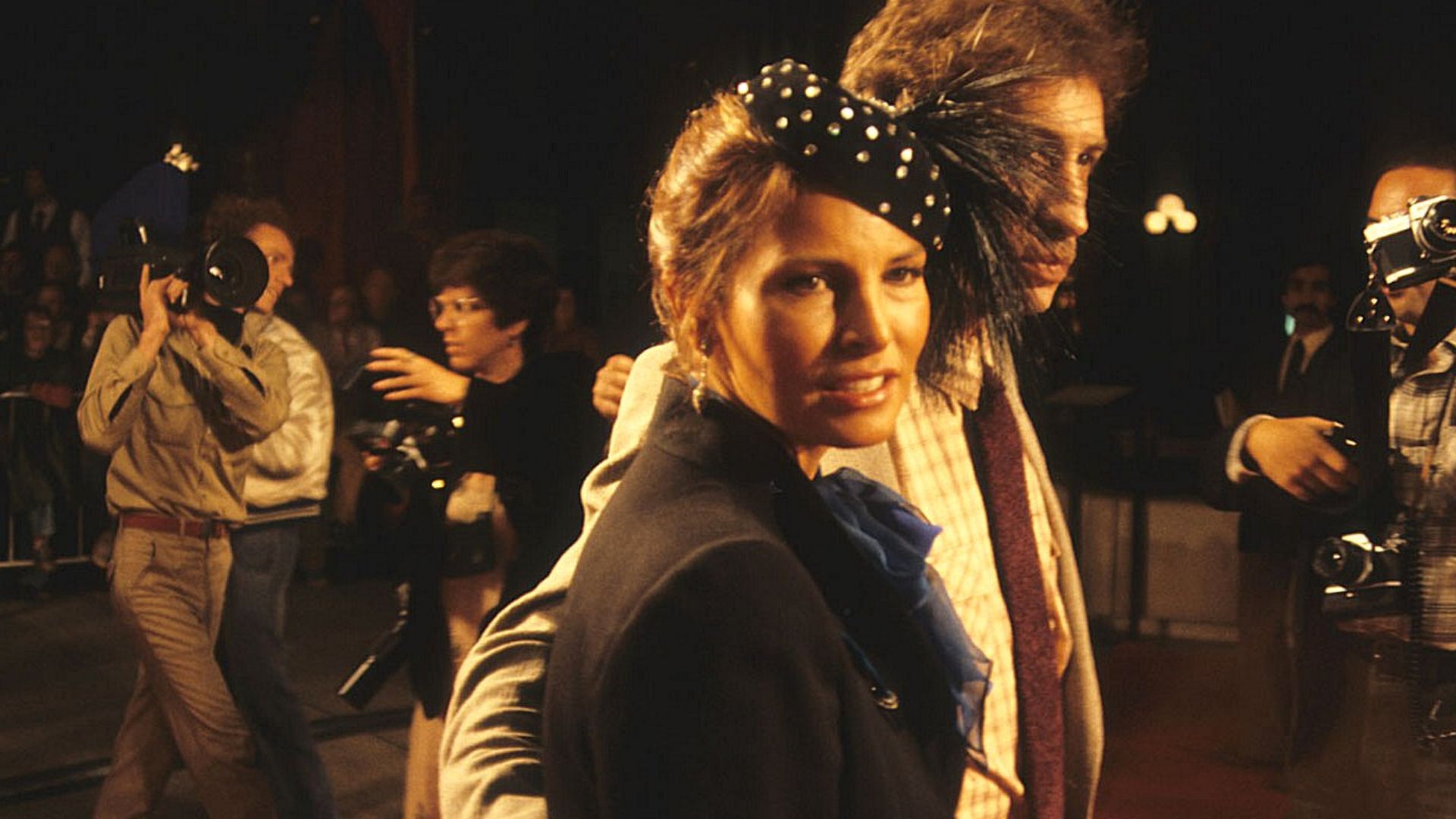 Raquel Welch and husband Andre Weinfeld arrive at the premiere of Midler's movie, THE ROSE, 1979.