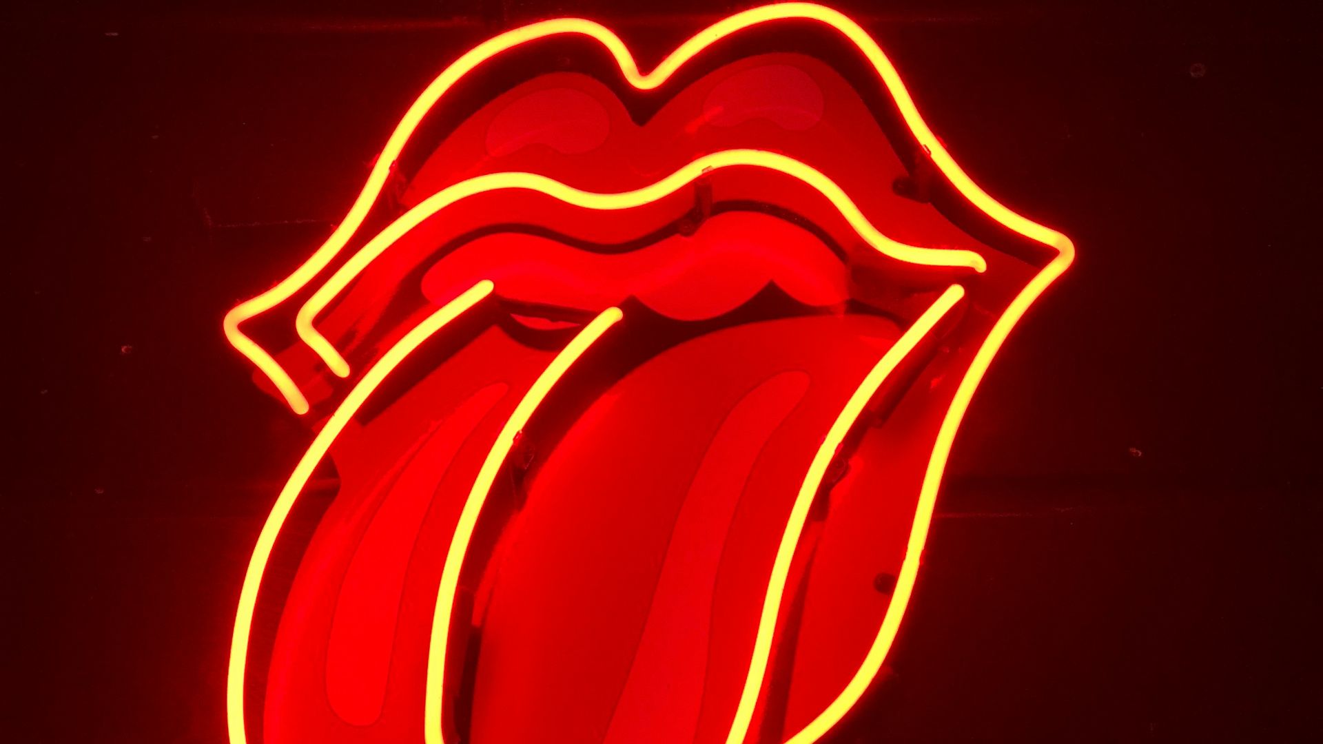 red tongue out neon light signage turned on